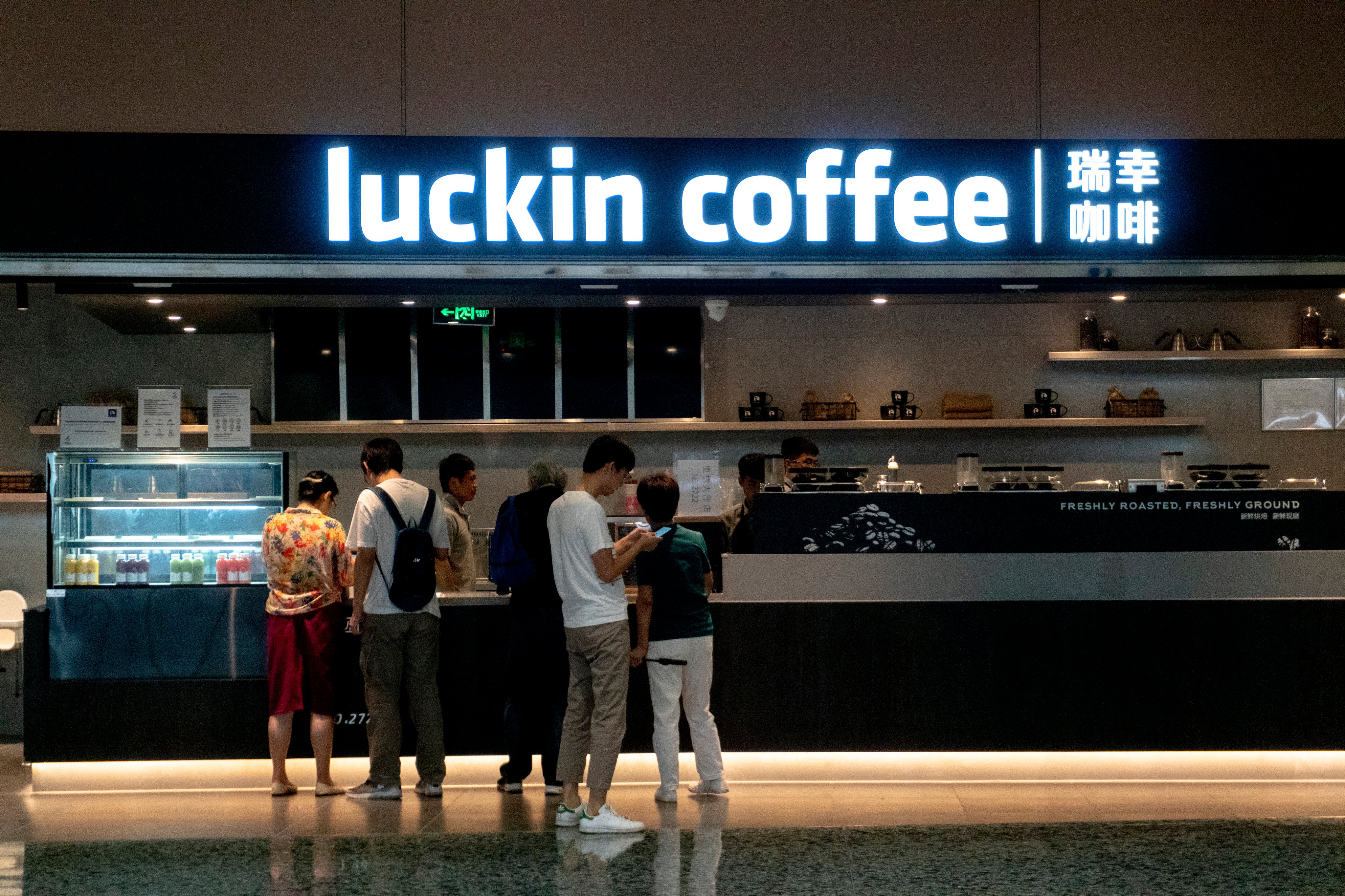 Patrons wait in line at a Luckin Coffee store in Beijing Daxing International Airport in 2019. Photo: Getty Images