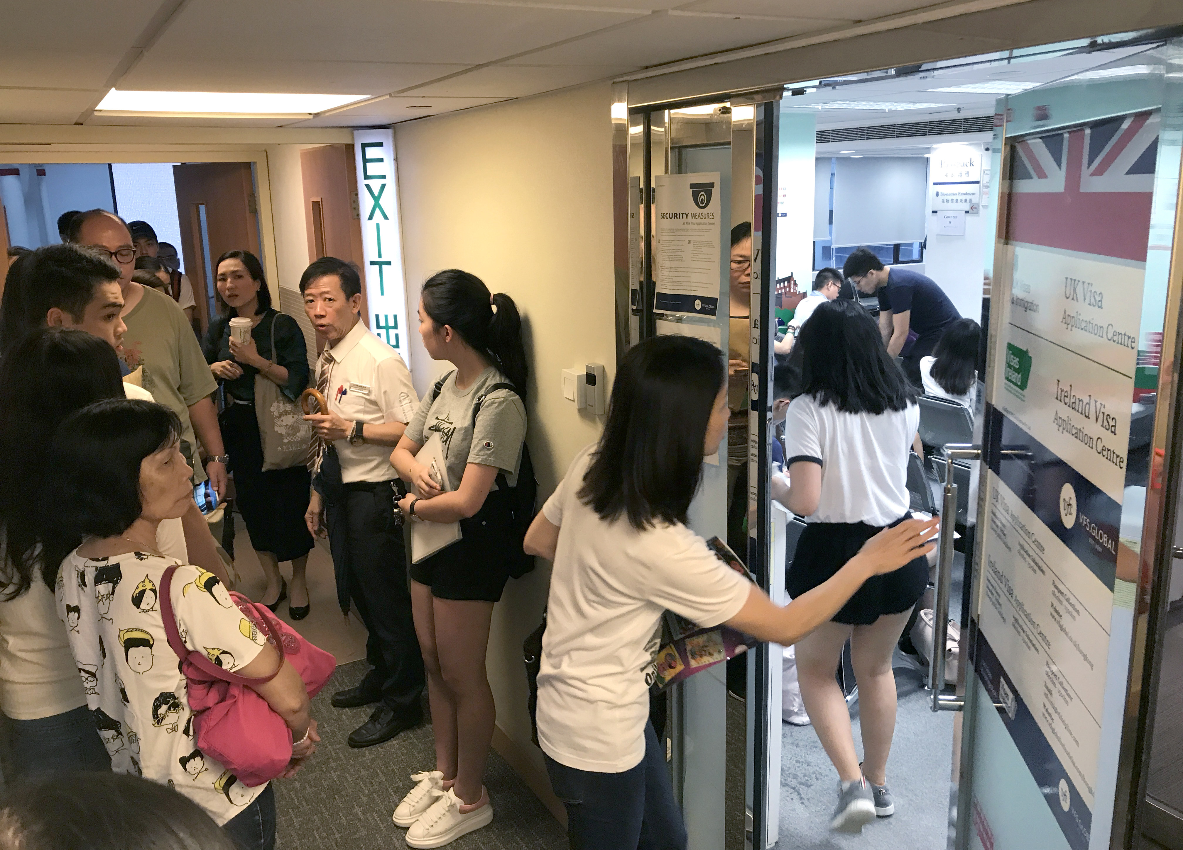 Students and their families queue at the UK Visa Application Centre in Causeway Bay, Hong Kong, on September 4, 2017. Britain’s Conservative-led government is targeting international students as a way to reduce immigration despite the key role they play in funding British universities and bringing talent into the country. Photo: Nora Tam