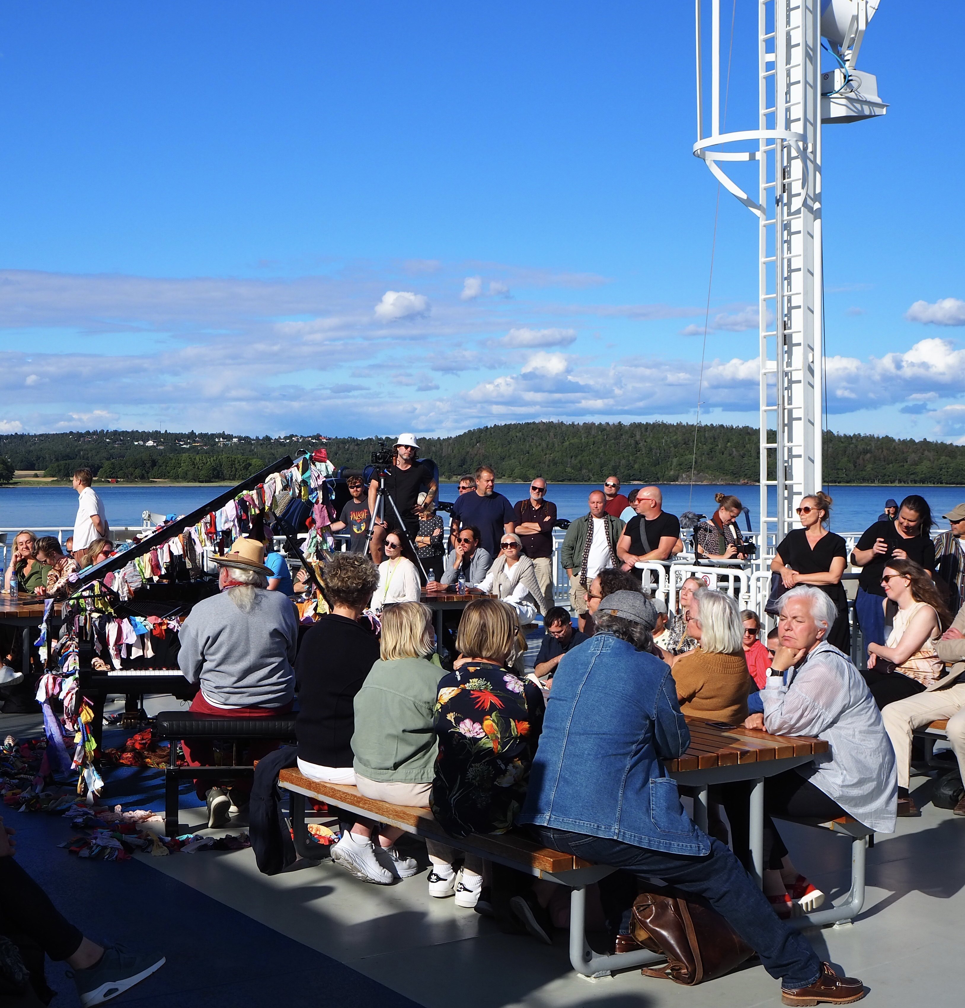 Pianist Charlemagne Palestine plays aboard the Basto Electric, the world’s largest all-electric ferry, on its sailing from Moss, Norway, to Jeloya, main venue of the Momentum arts festival, in August 2021.Photo: Mark Footer