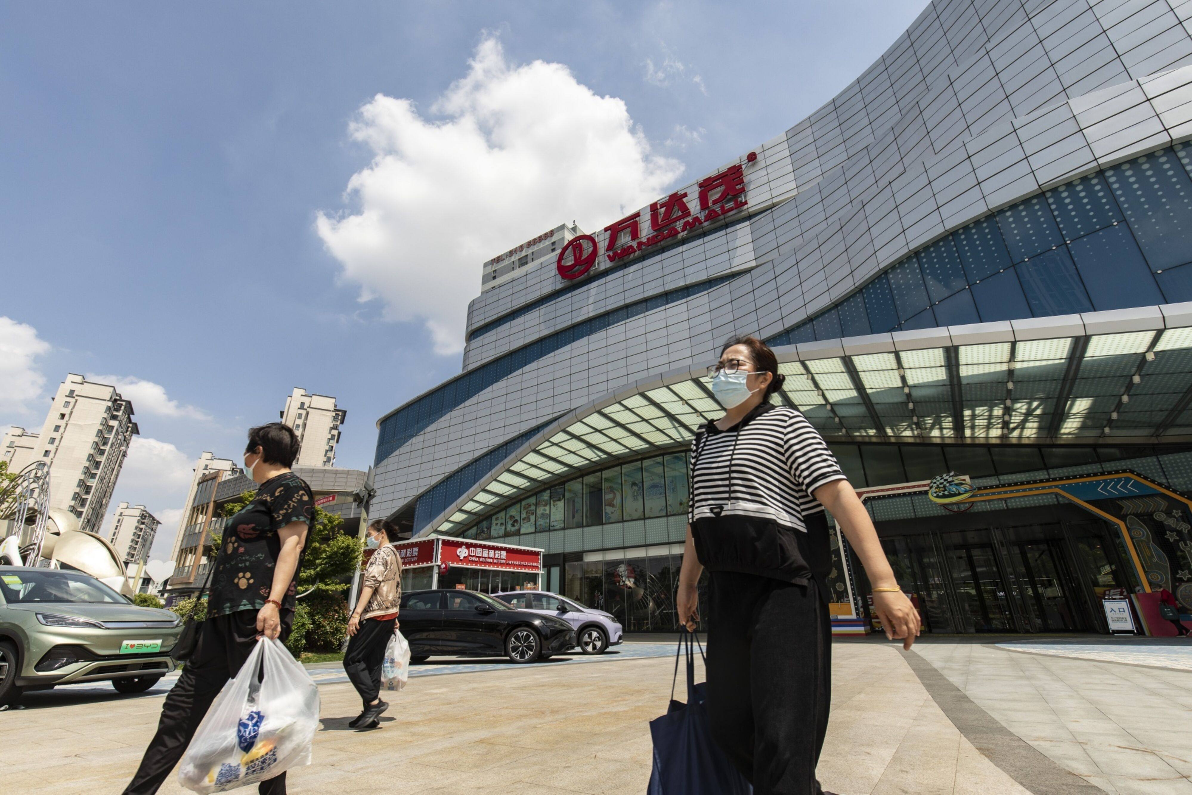 Shoppers depart Dalian Wanda Group’s Qingpu shopping centre in Shanghai, on May 25, 2023. Photo: Bloomberg