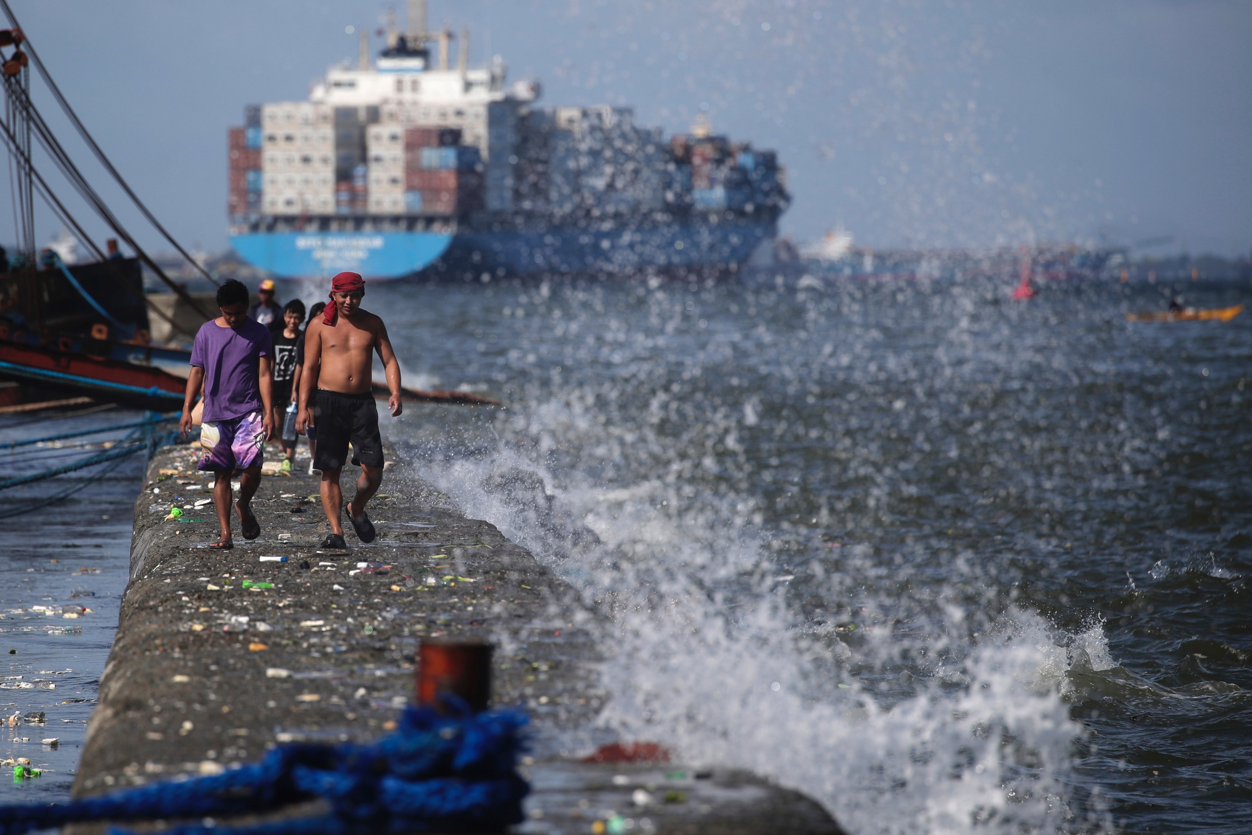 Fishermen in Manila, Philippines. Ocean warming, along with overfishing, has already caused fish stock depletion by between 15 and 35 per cent over the past eight decades. Photo: EPA-EFE