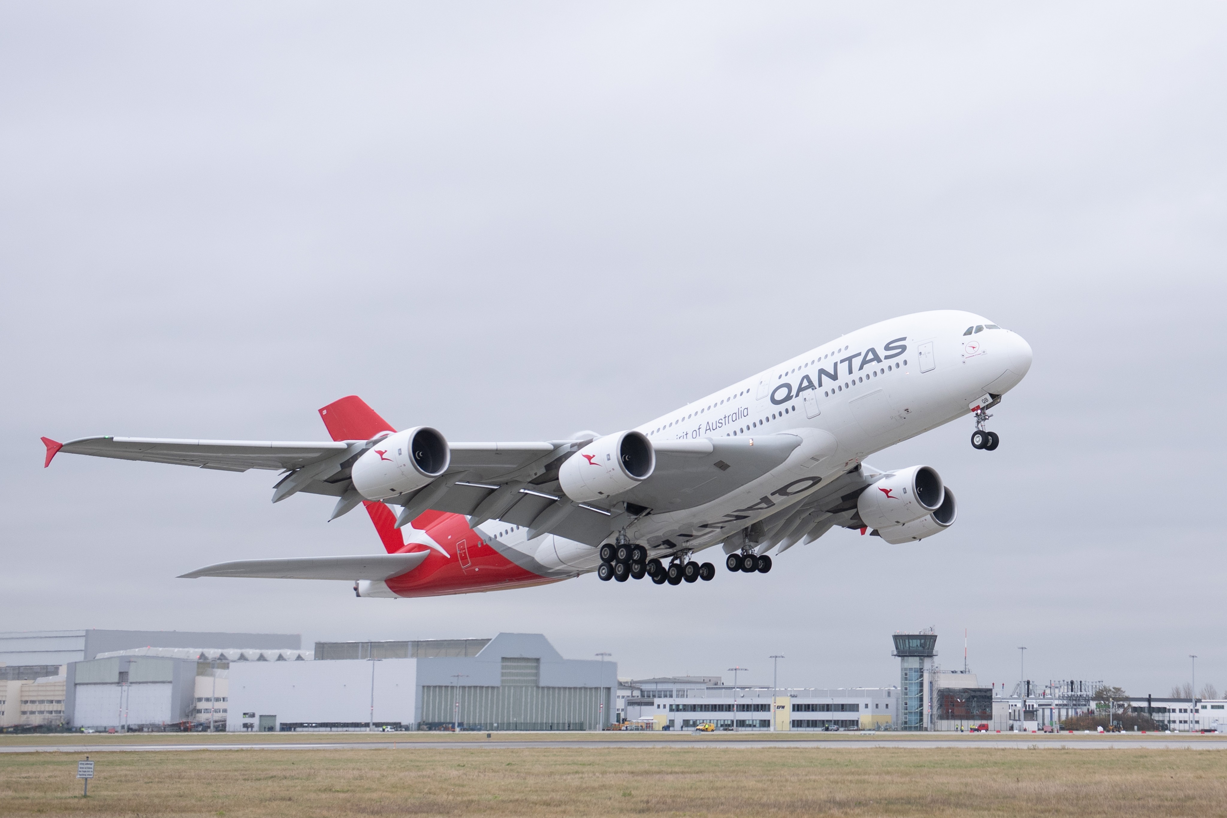 Qantas said flat shoes can now be worn with all uniforms, as can diamond earrings. Anyone can wear makeup if they choose to, and have hair in a ponytail or bun. Photo: dpa