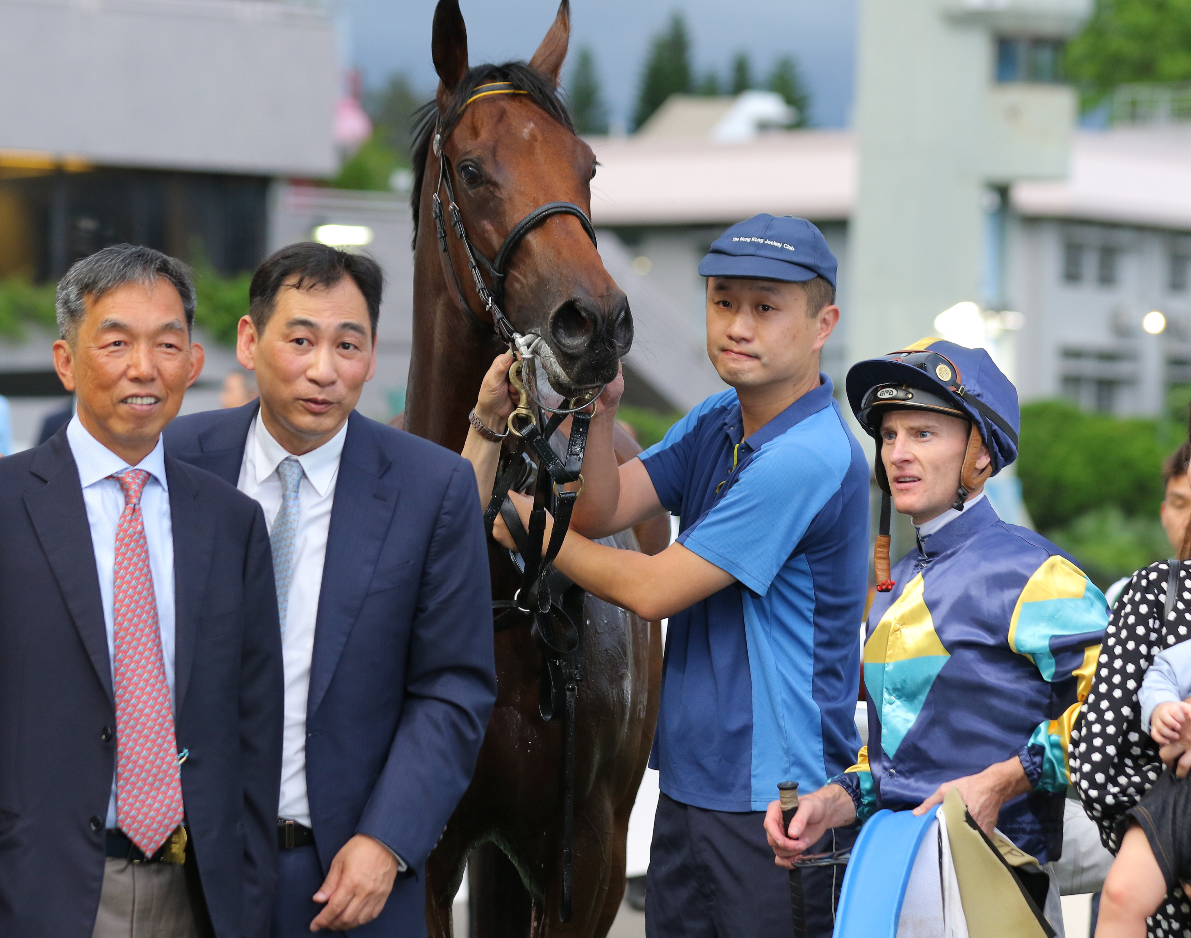 Trainer Michael Chang, rider Zac Purton and fellow connections celebrate Lady’s Choice’s win at Sha Tin on Saturday. Photos: Kenneth Chan