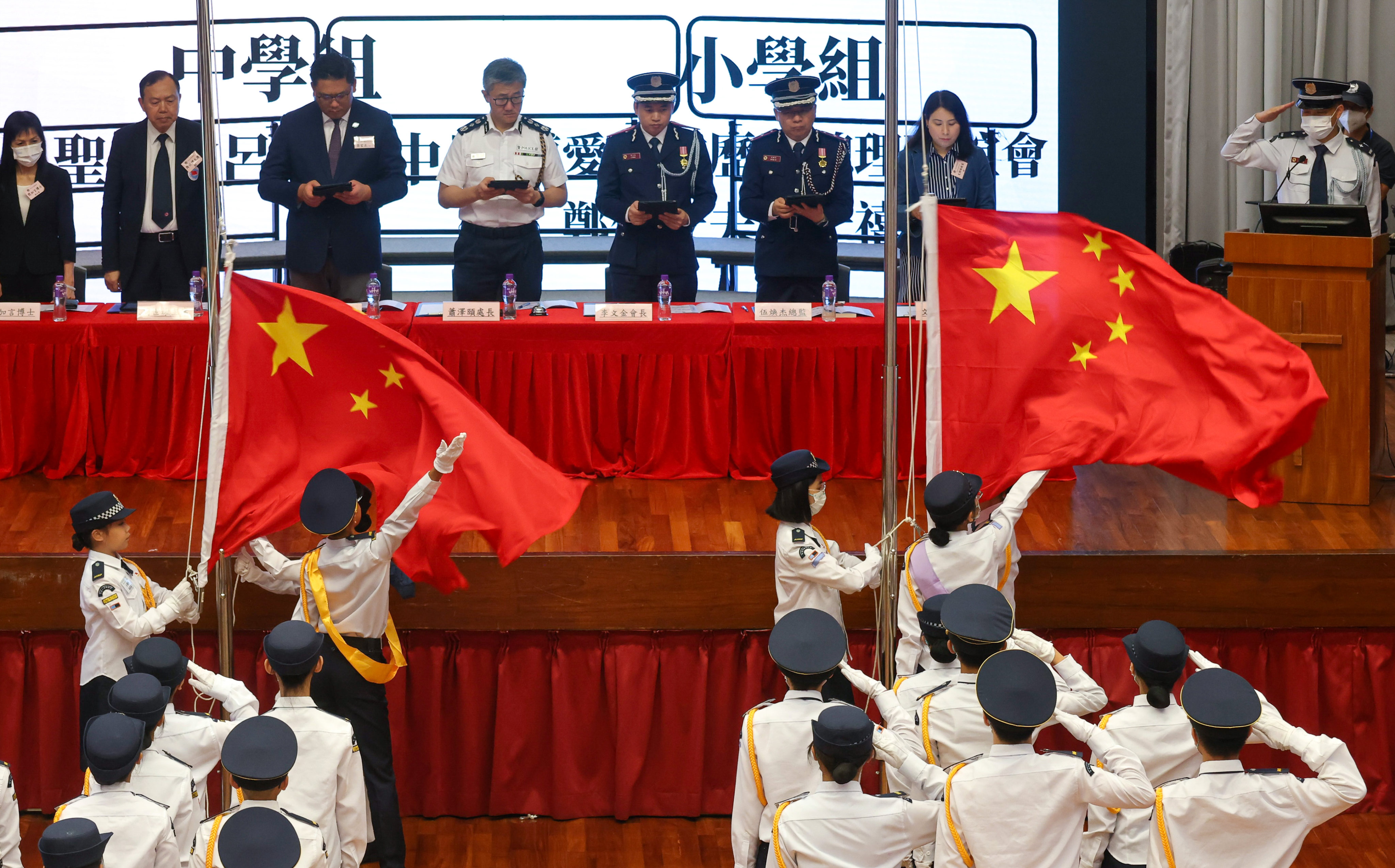 Students take part in a patriotic event in May, attended by Commissioner of Police Raymond Siu (centre left). Photo: Jonathan Wong