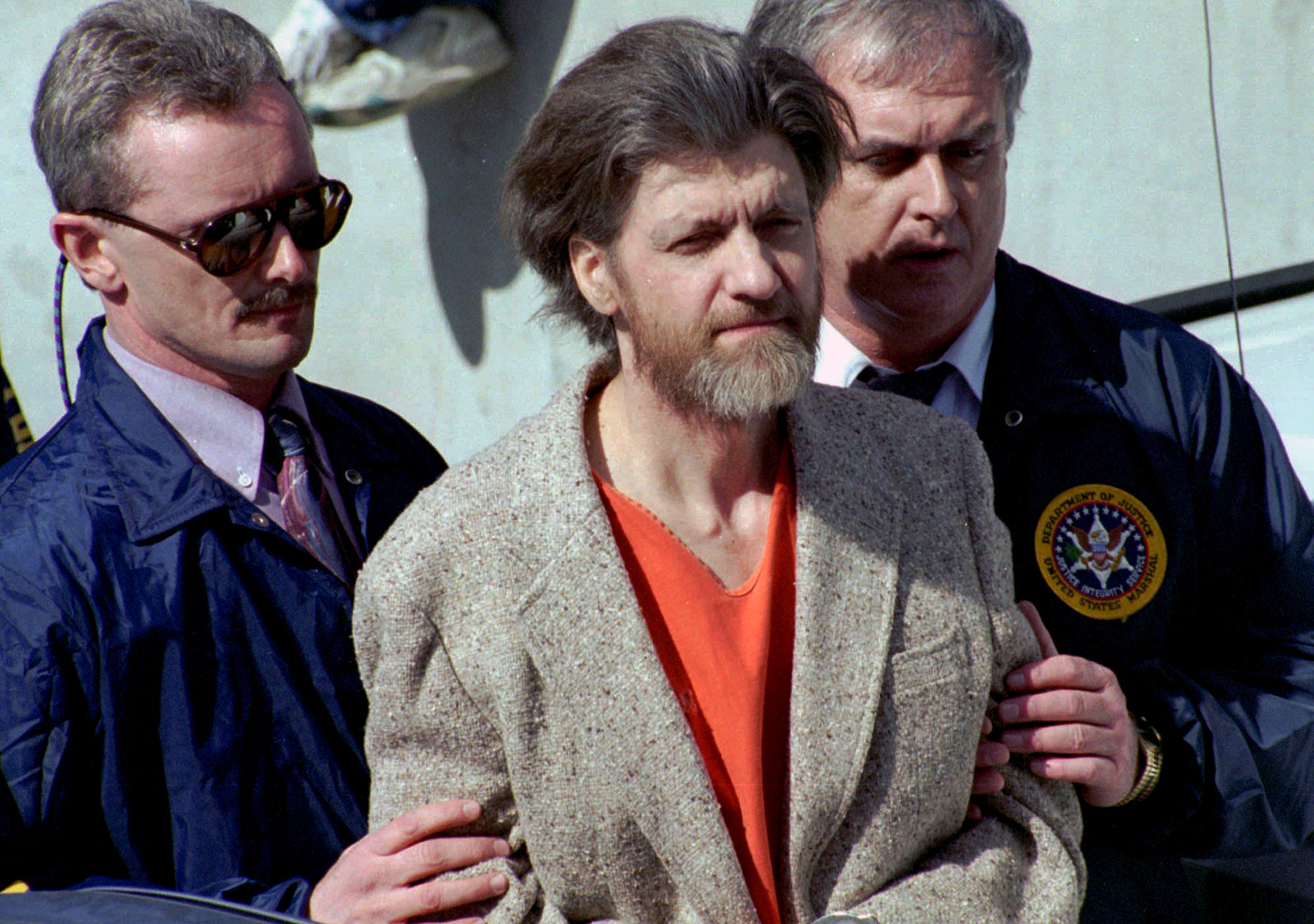 Unabomber Theodore “Ted” Kaczynski is flanked by federal agents in Helena, Montana, US in 1996. He died in prison on Saturday at the age of 81. Photo: AP