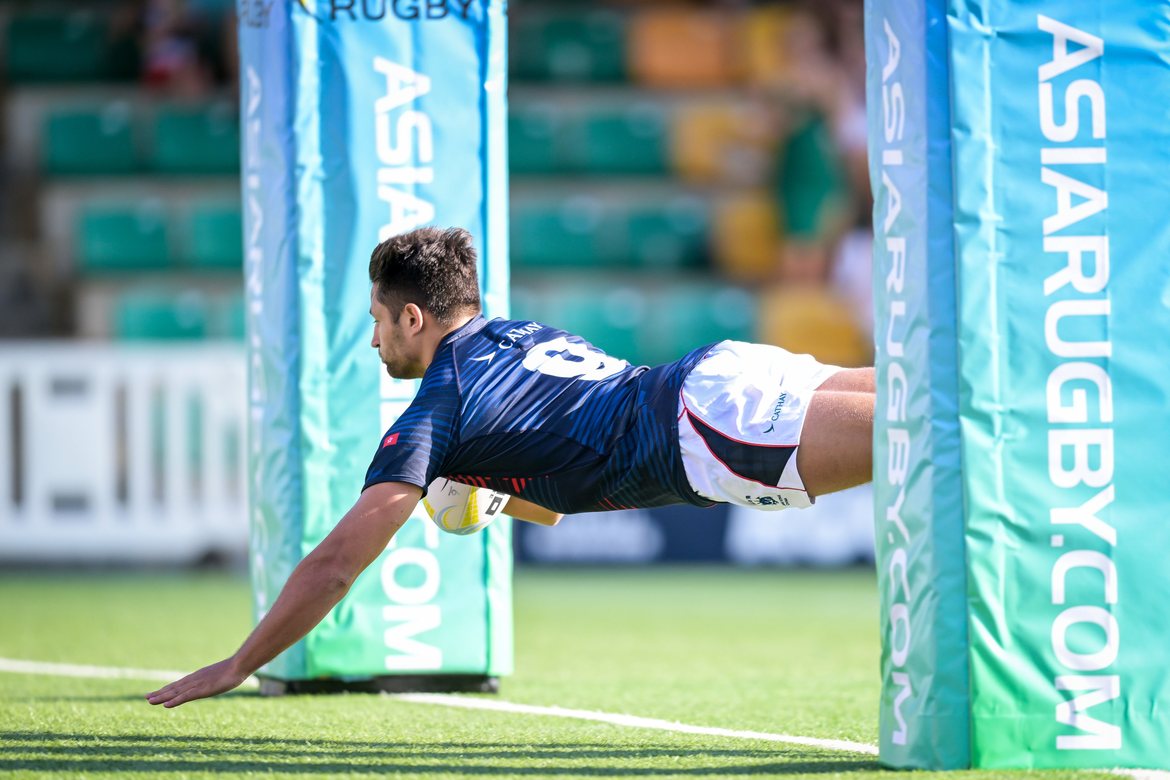 Hong Kong scrum-half Jamie Lauder dives in under the posts to score his side’s first try against Malaysia in the Asia Rugby Championship clash at Hong Kong Football Club. Photo: Handout.