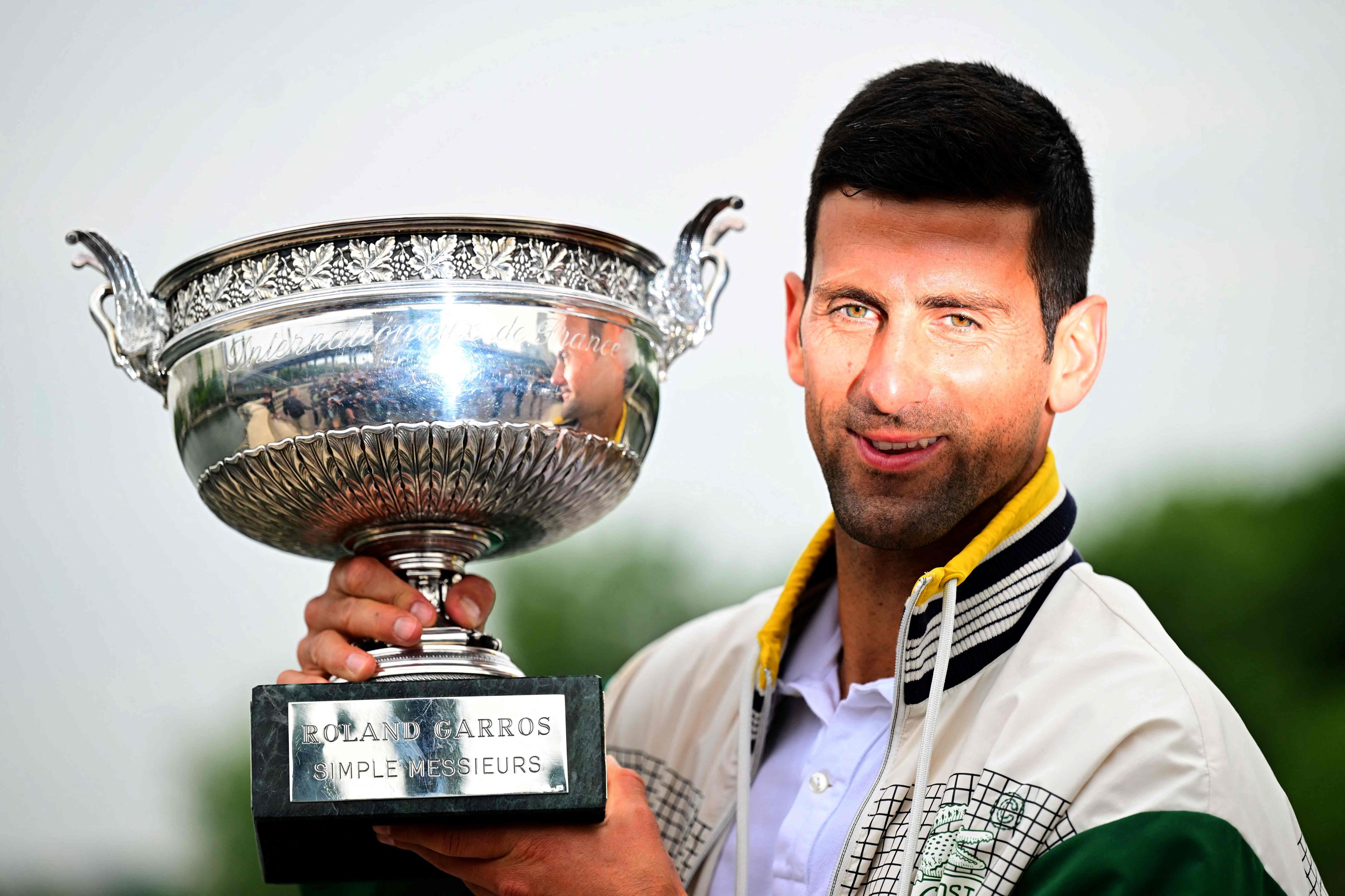 Serbia’s Novak Djokovic poses with the Musketeers’ Trophy after winning the French Open. Photo: AFP