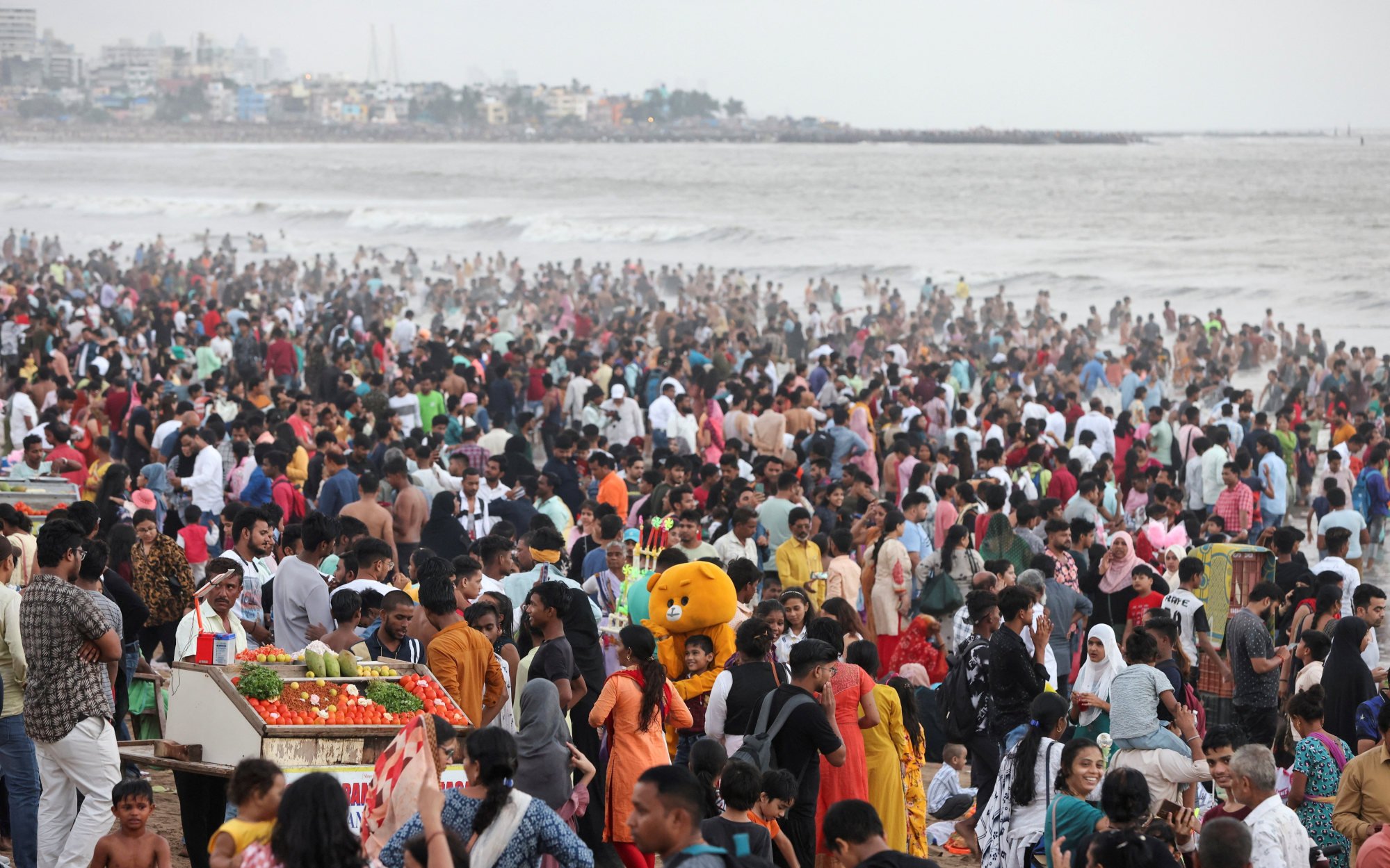 A crowded beach in Mumbai pictured last summer. Indians are 158.76cm tall on average. Photo: Reuters