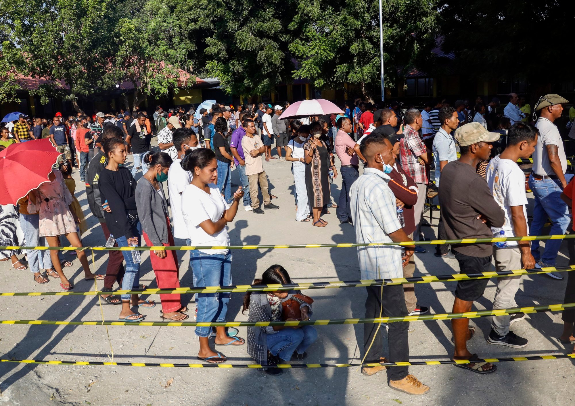 People queue to cast their votes during parliamentary elections in Dili last month. People in East Timor are 155.47cm tall on average. Photo: EPA-EFE