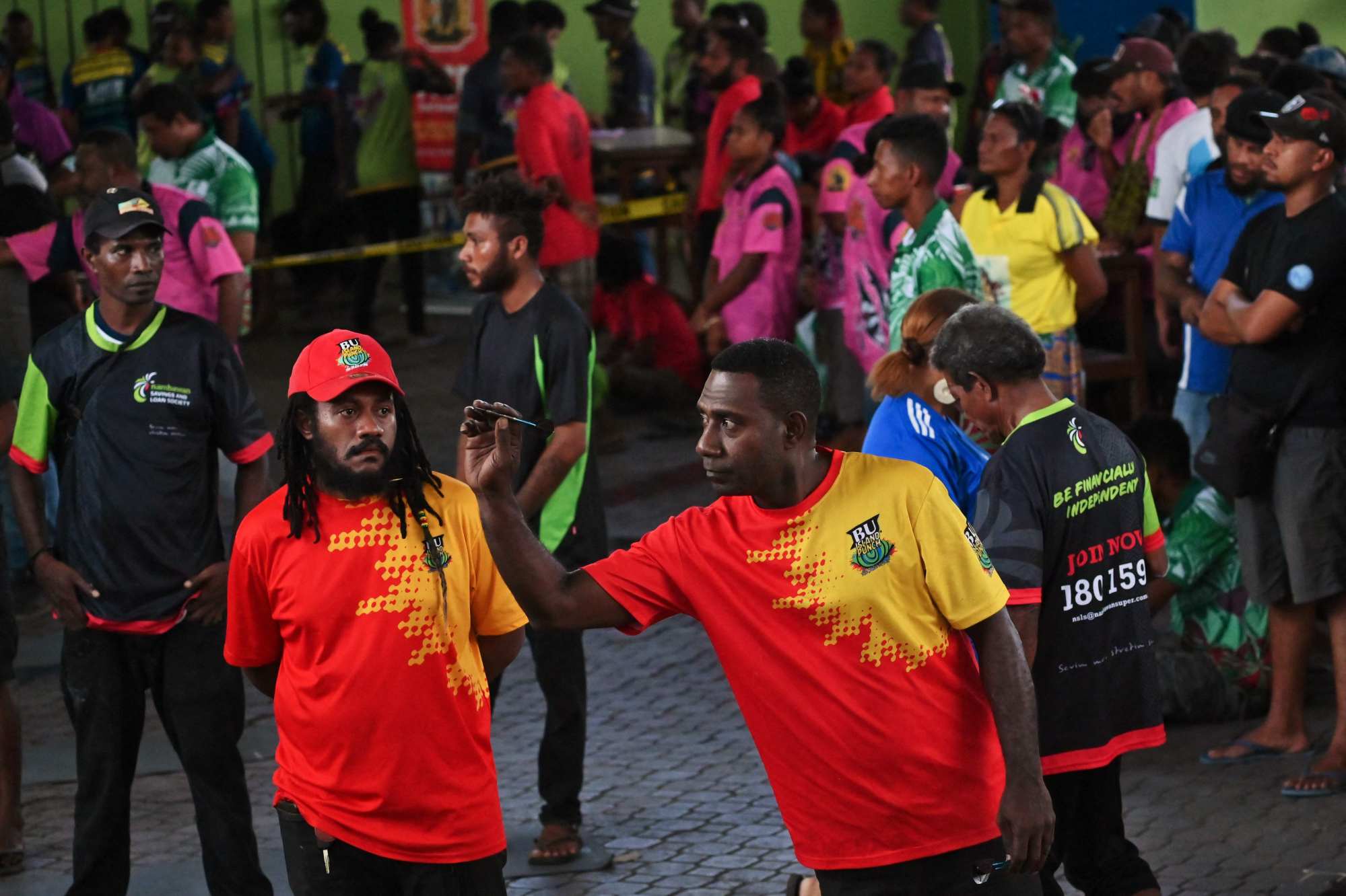 A darts competition in Port Moresby last month. Papuan men are 163.56cm tall on average. Photo: AFP