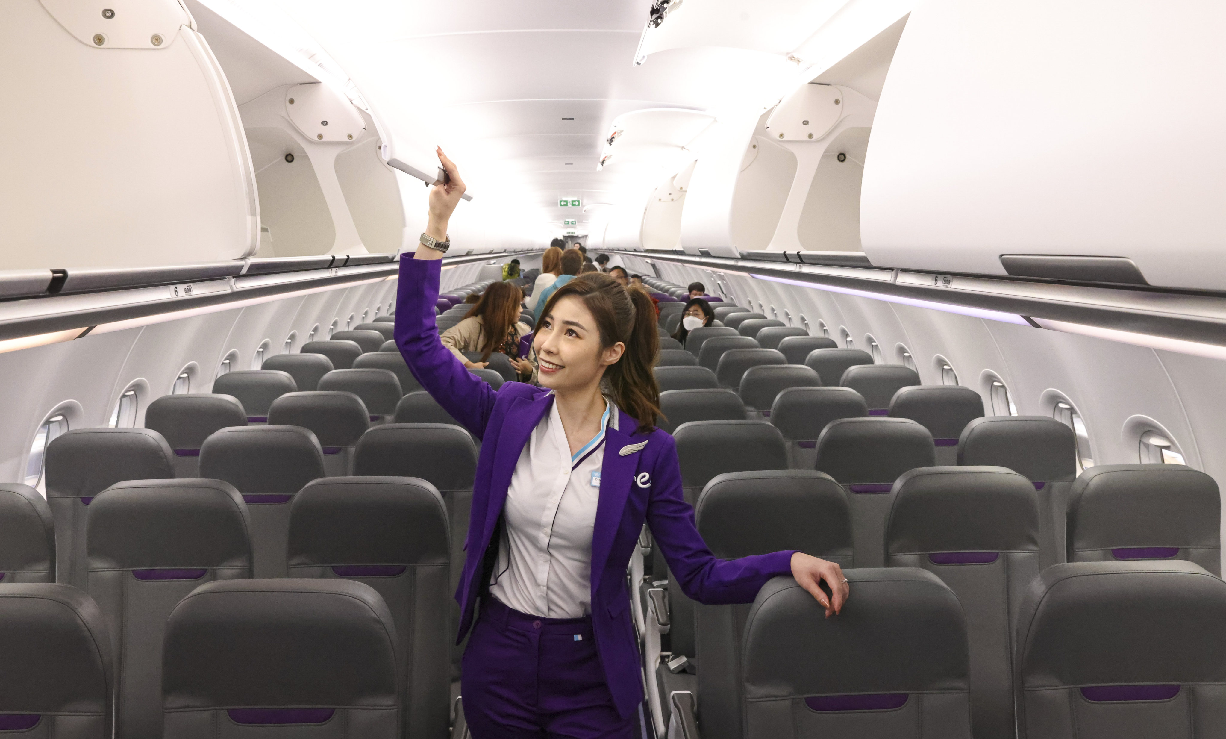 A HK Express flight attendant looks around the airline’s first Airbus A321neo aircraft that was delivered in March as it anticipates a rebound in aviation demand. Photo: K. Y. Cheng