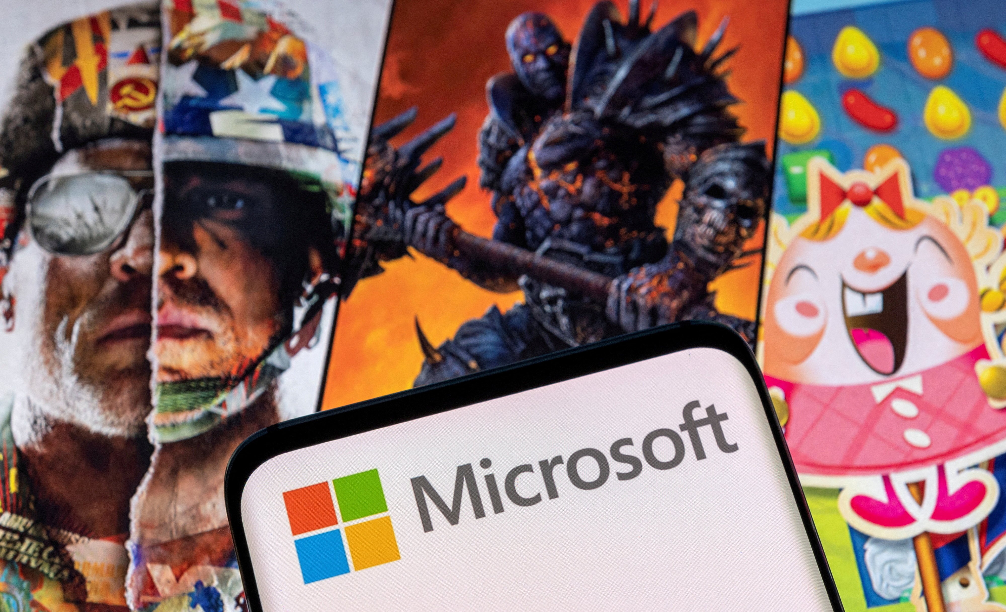 Microsoft’s logo is seen on a smartphone displayed atop Activision Blizzard game characters in this illustration taken January 18, 2022. Photo: Reuters
