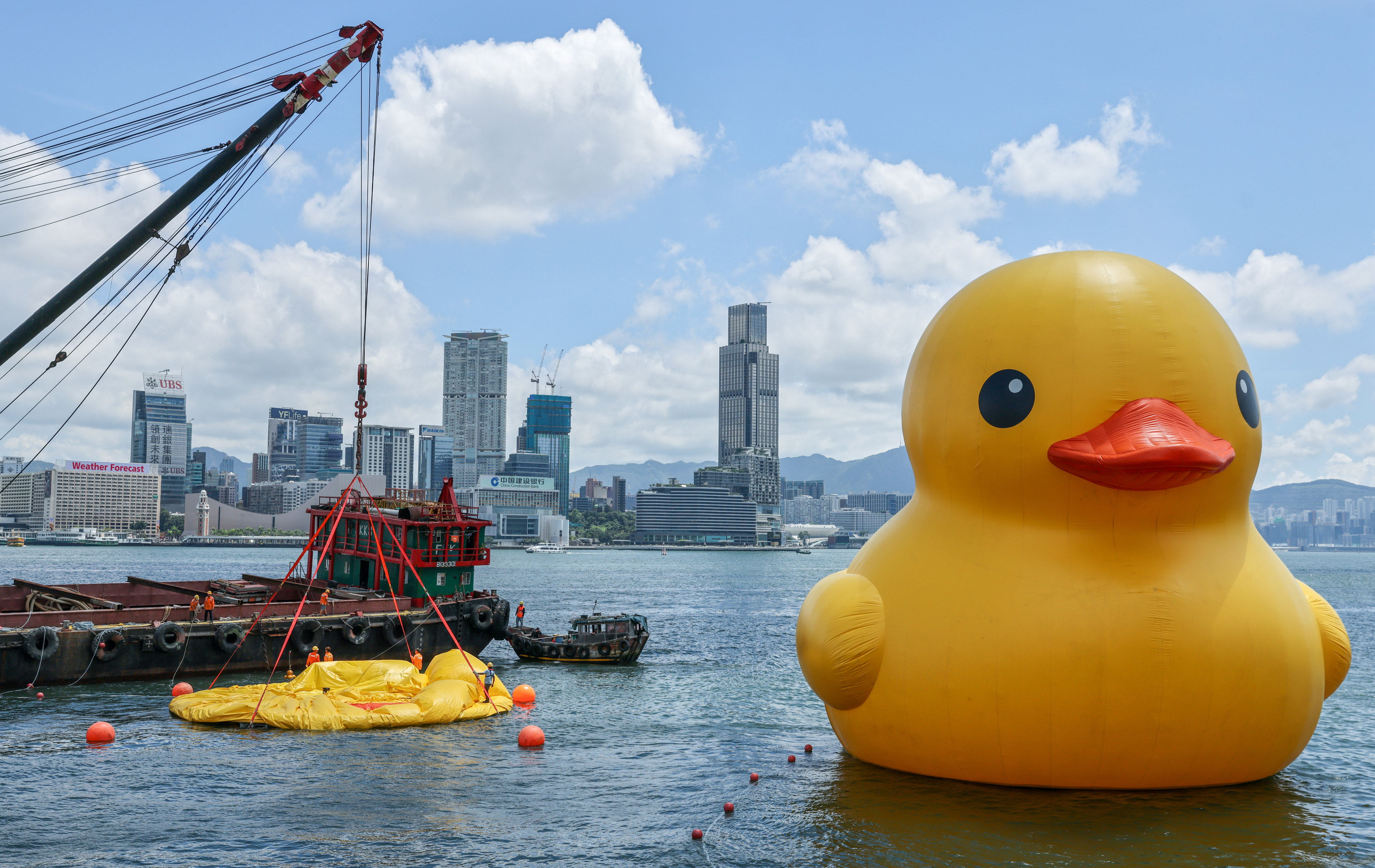 A deflated giant rubber duck has sprung back to Tamar and has been reunited with its twin at the Central harbourfront, two days after withering in Hong Kong’s sweltering heat. Photo: May Tse