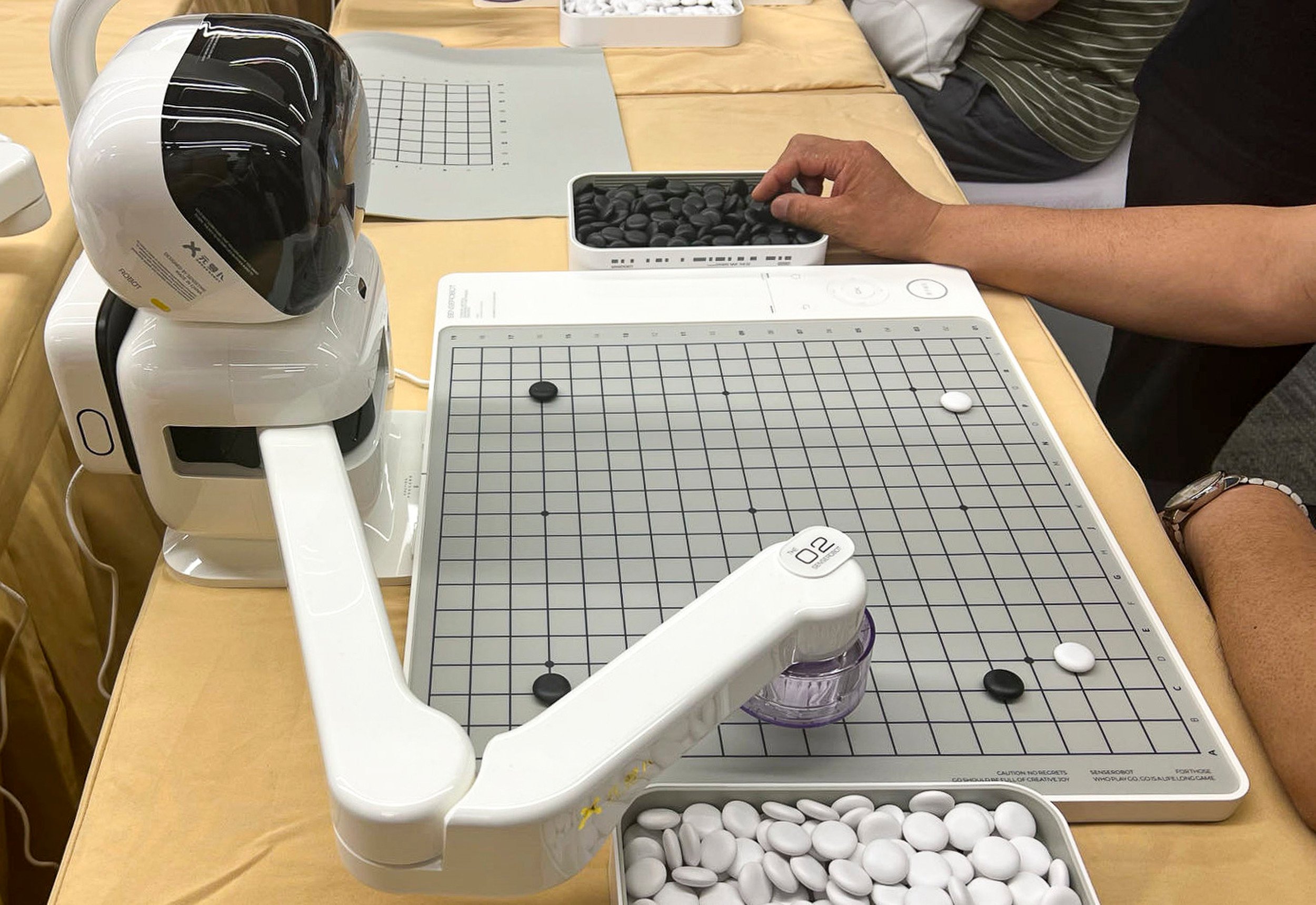 The new product called SenseRobot can play Go with human opponents on a real chessboard. Photo: SCMP/ Ann Cao