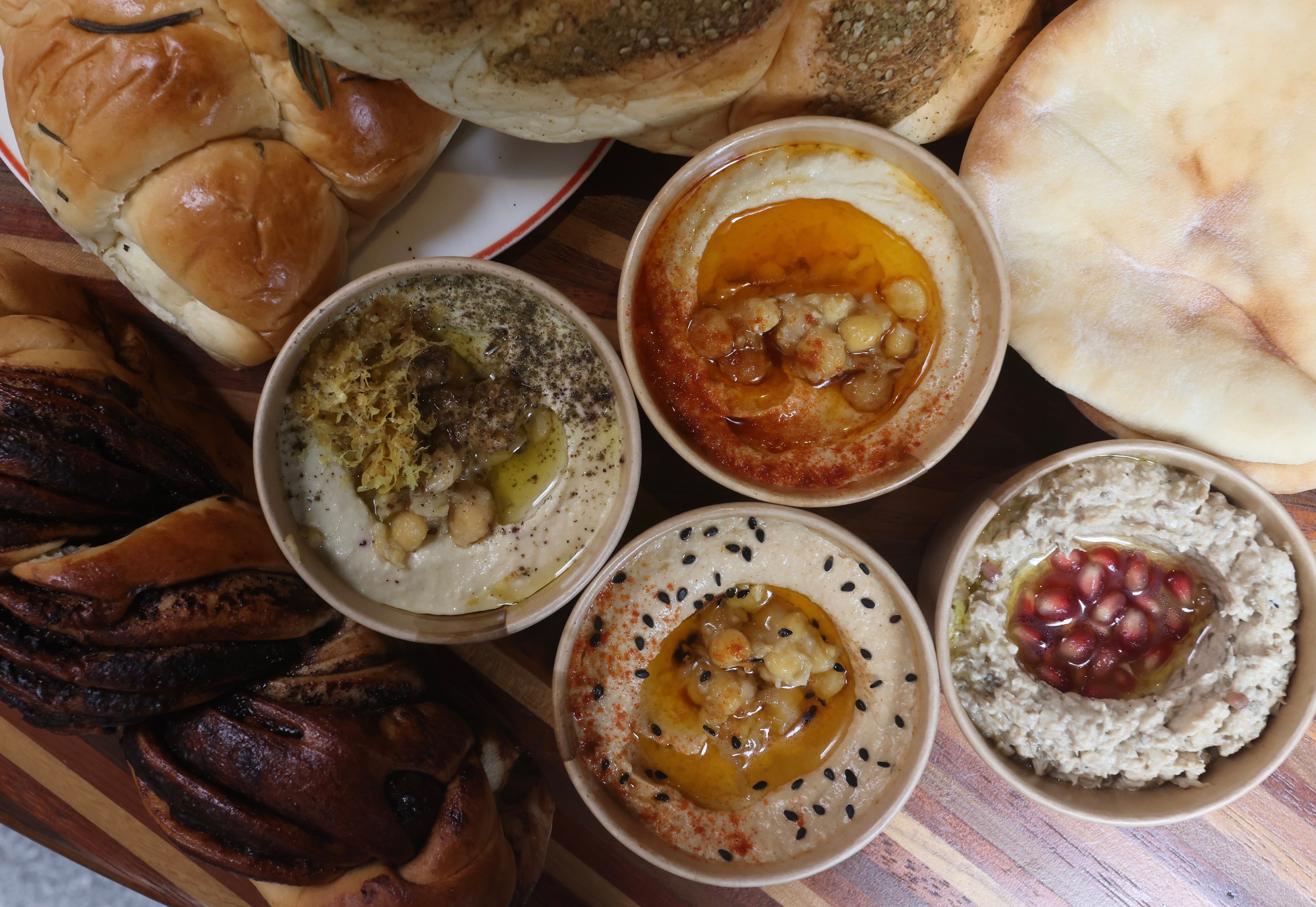 A selection of hummus and breads from House of Hummus. Photo: Jonathan Wong