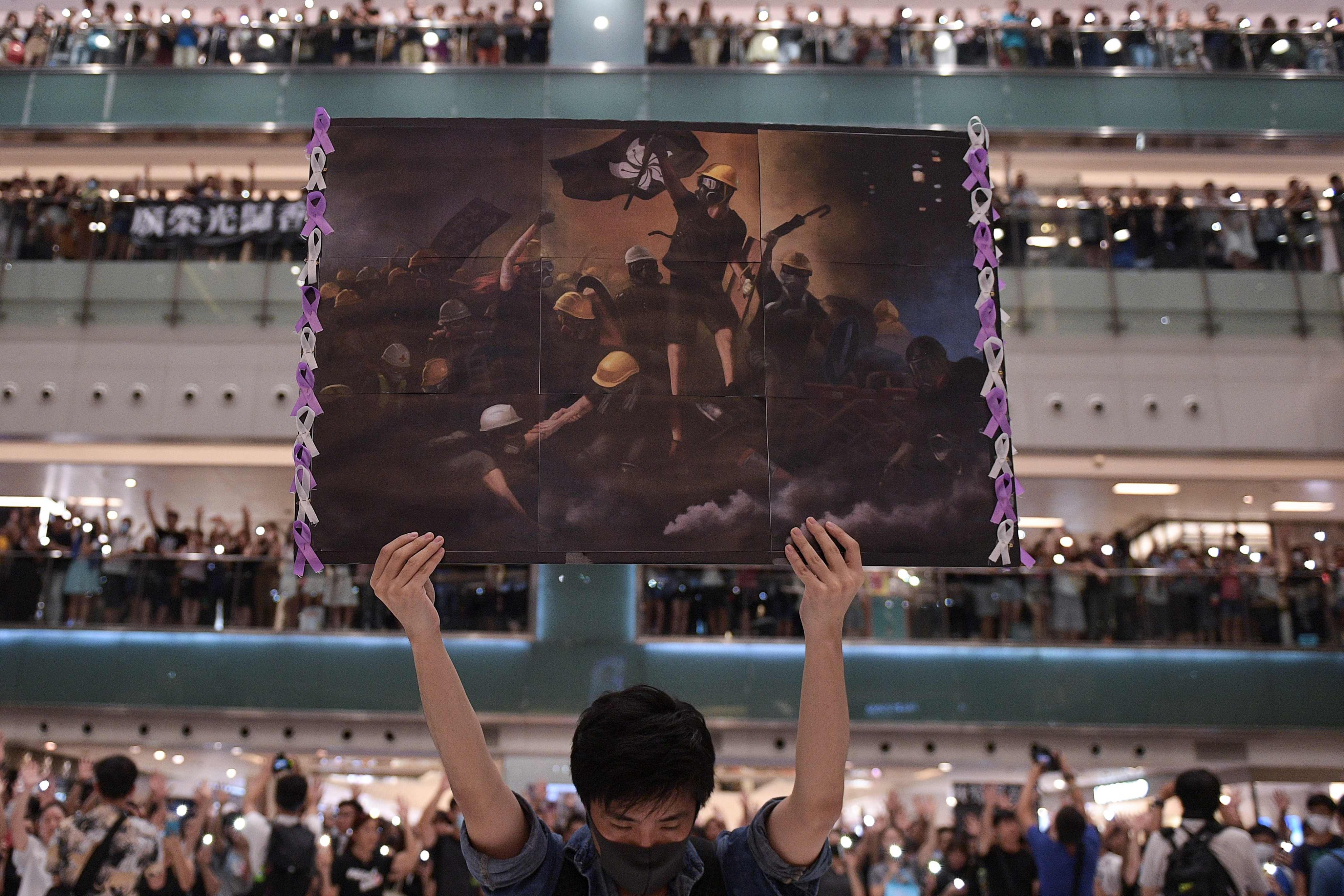 Hongkongers gather in a mall in September 2019 to hail the then newly penned protest song. Photo: AFP
