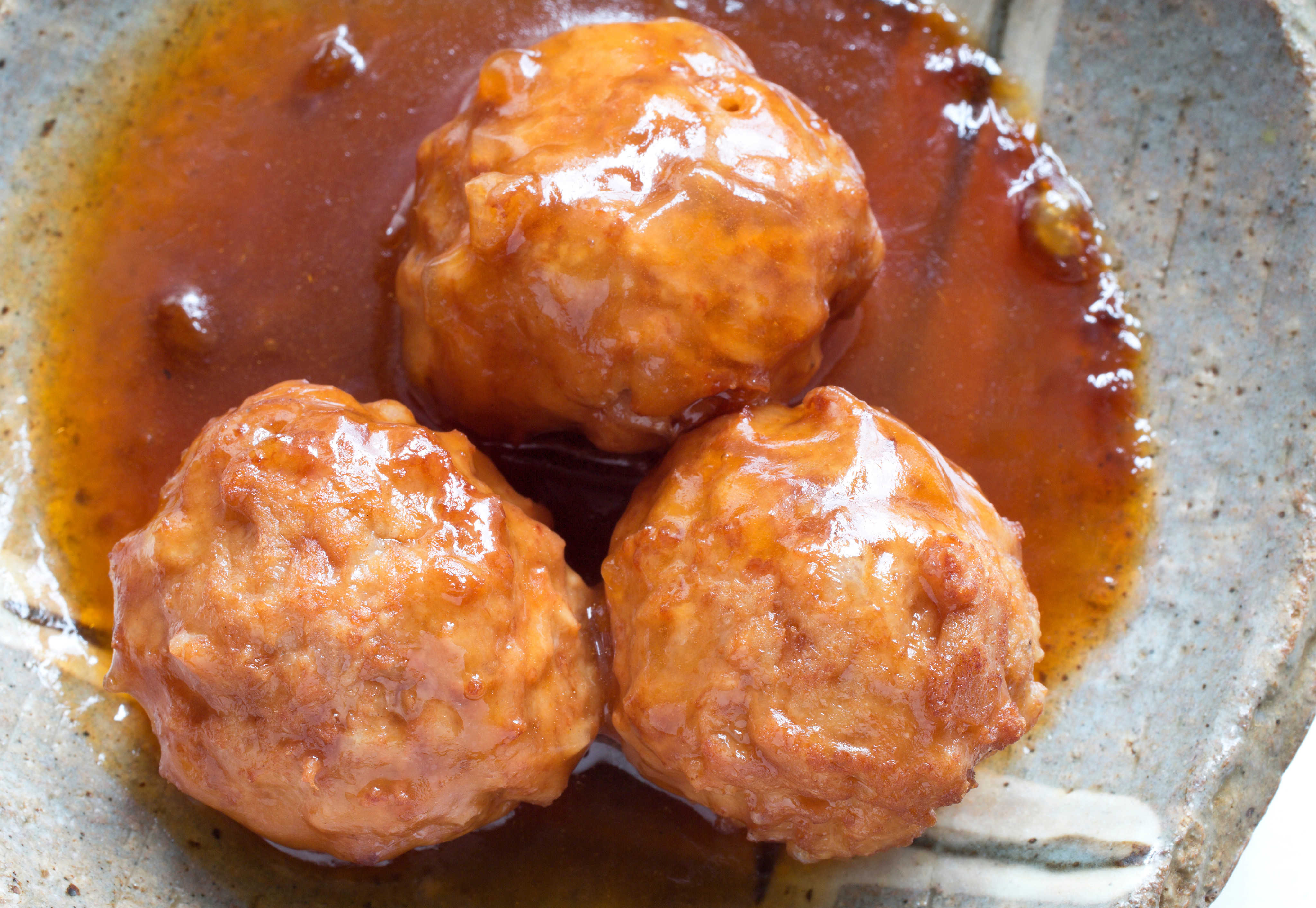 At Chinese restaurants in the UK, sweet and sour pork balls still tend to come served in a bright orange sauce. Photo: Getty Images