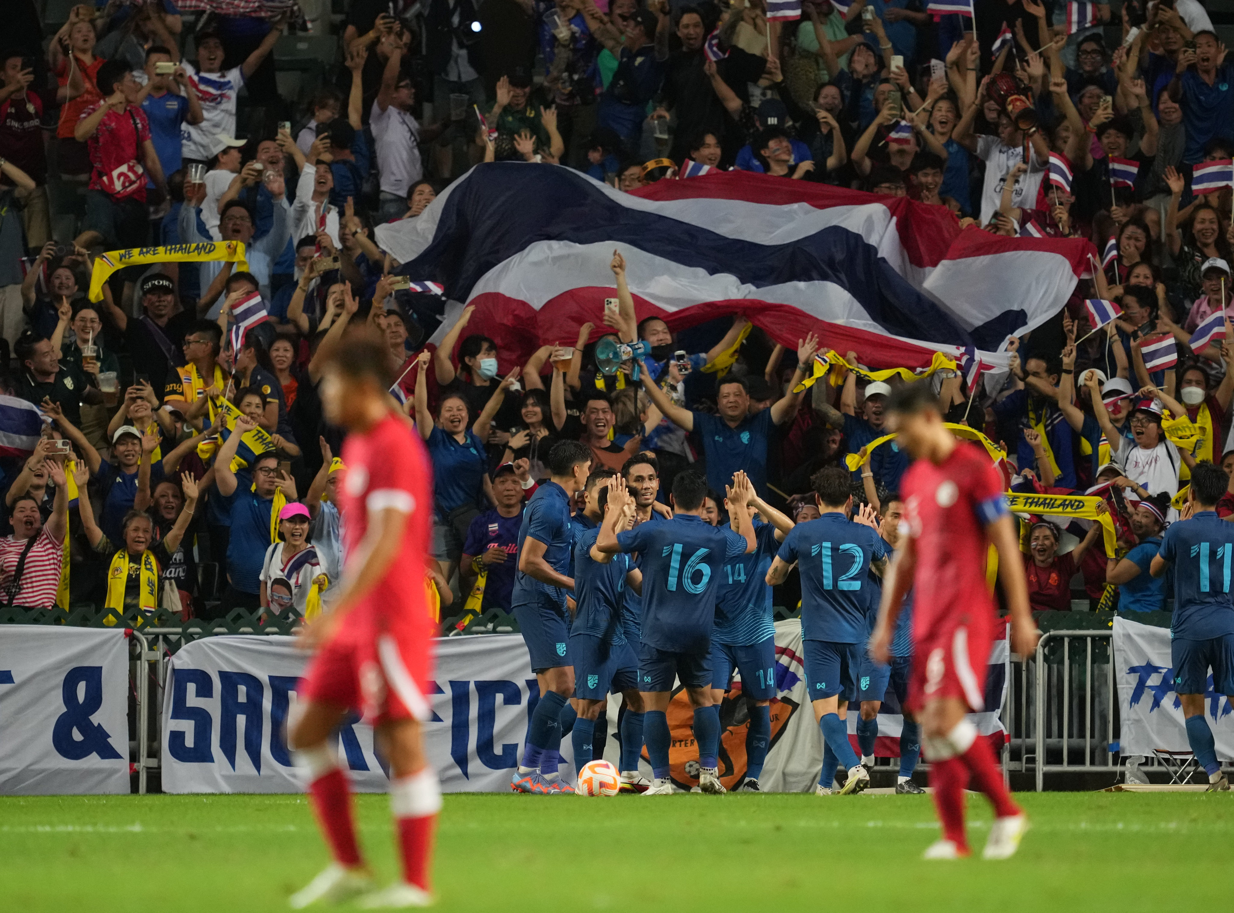 Thailand players celebrate after scoring the only goal of the game at Hong Kong Stadium. Photo: Sam Tsang