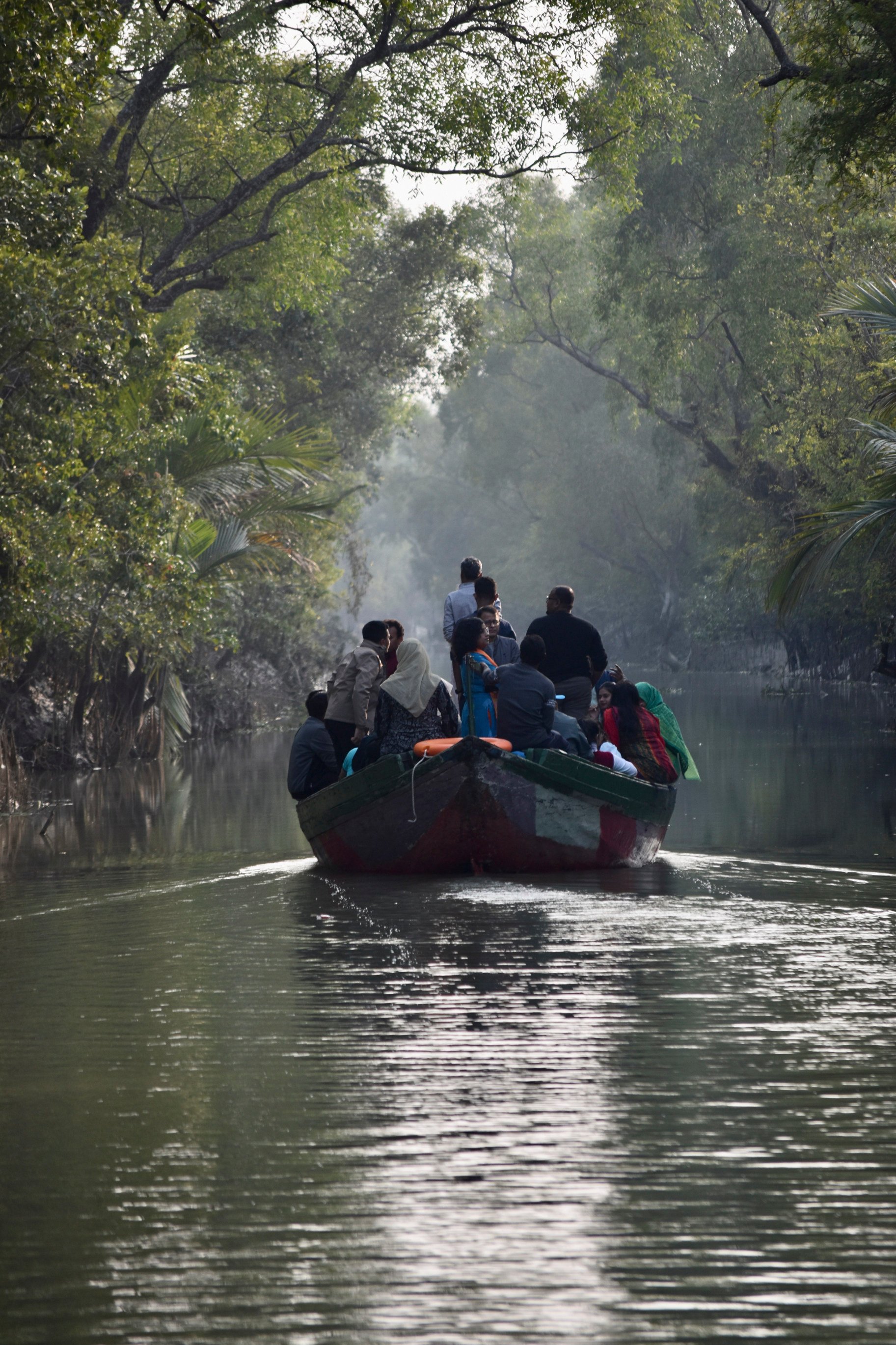 Tourists on a wildlife cruise of the Bangladeshi Sundarbans take smaller wooden boats that give access to the area’s narrow waterways, offering a glimpse into the depths of the mangrove forest. Photo: Victoria Burrows