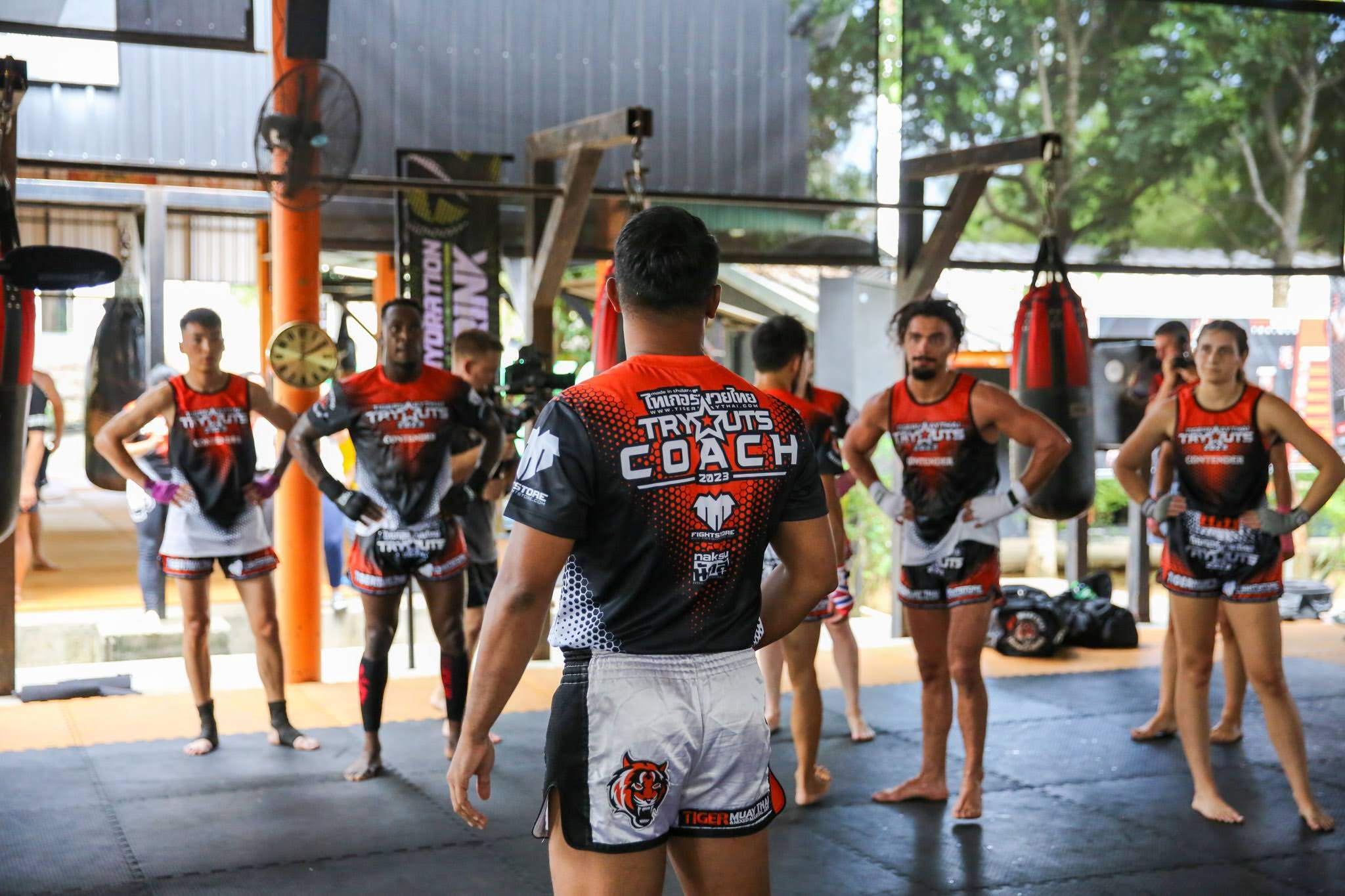 Athletes listen to their coach at the 2023 Tiger Muay Thai tryouts in Phuket, Thailand. Photo: Hip.jpeg