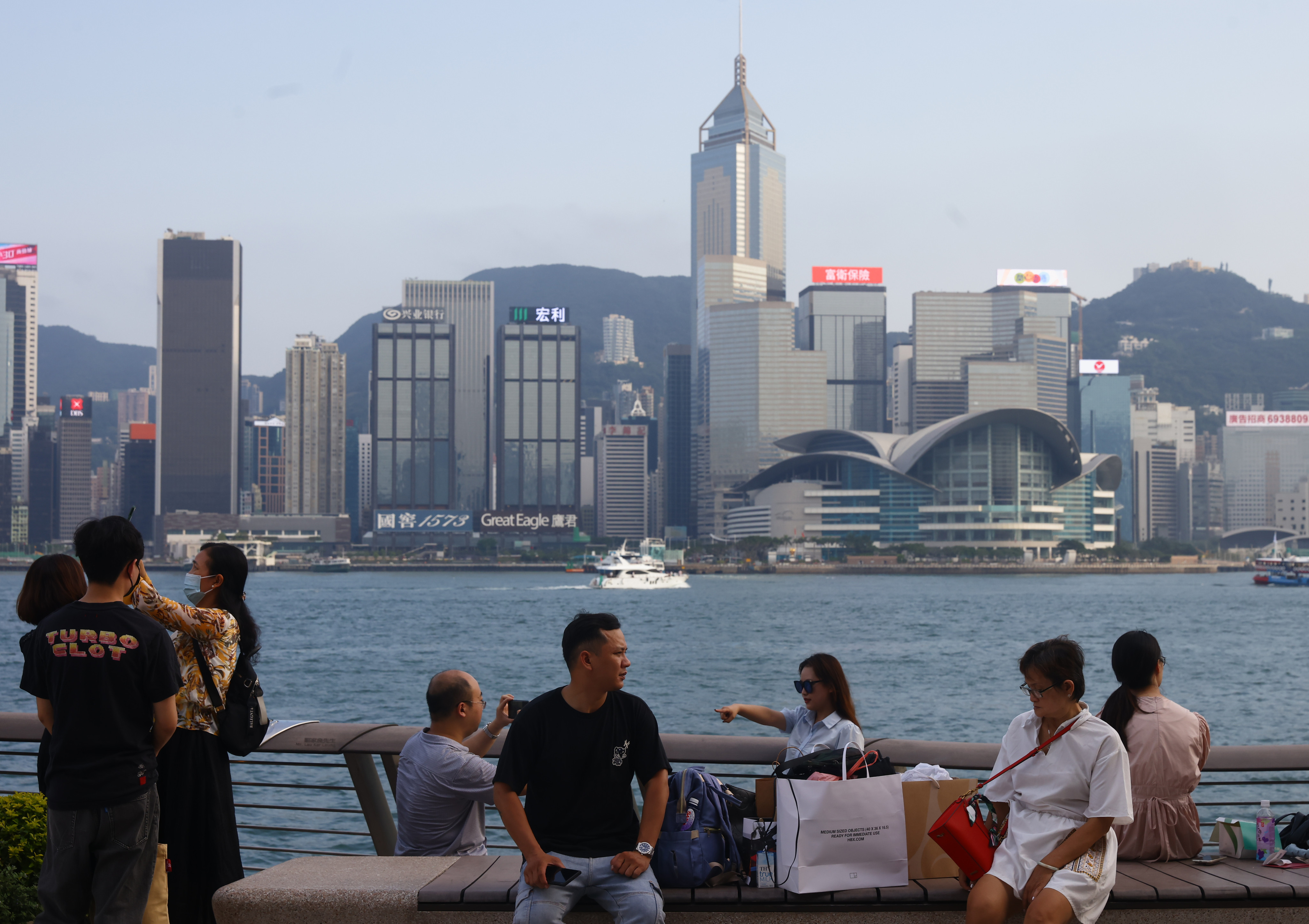 Tourists visit the waterfront in Tsim Sha Tsui.    10JUN23  SCMP /Dickson Lee