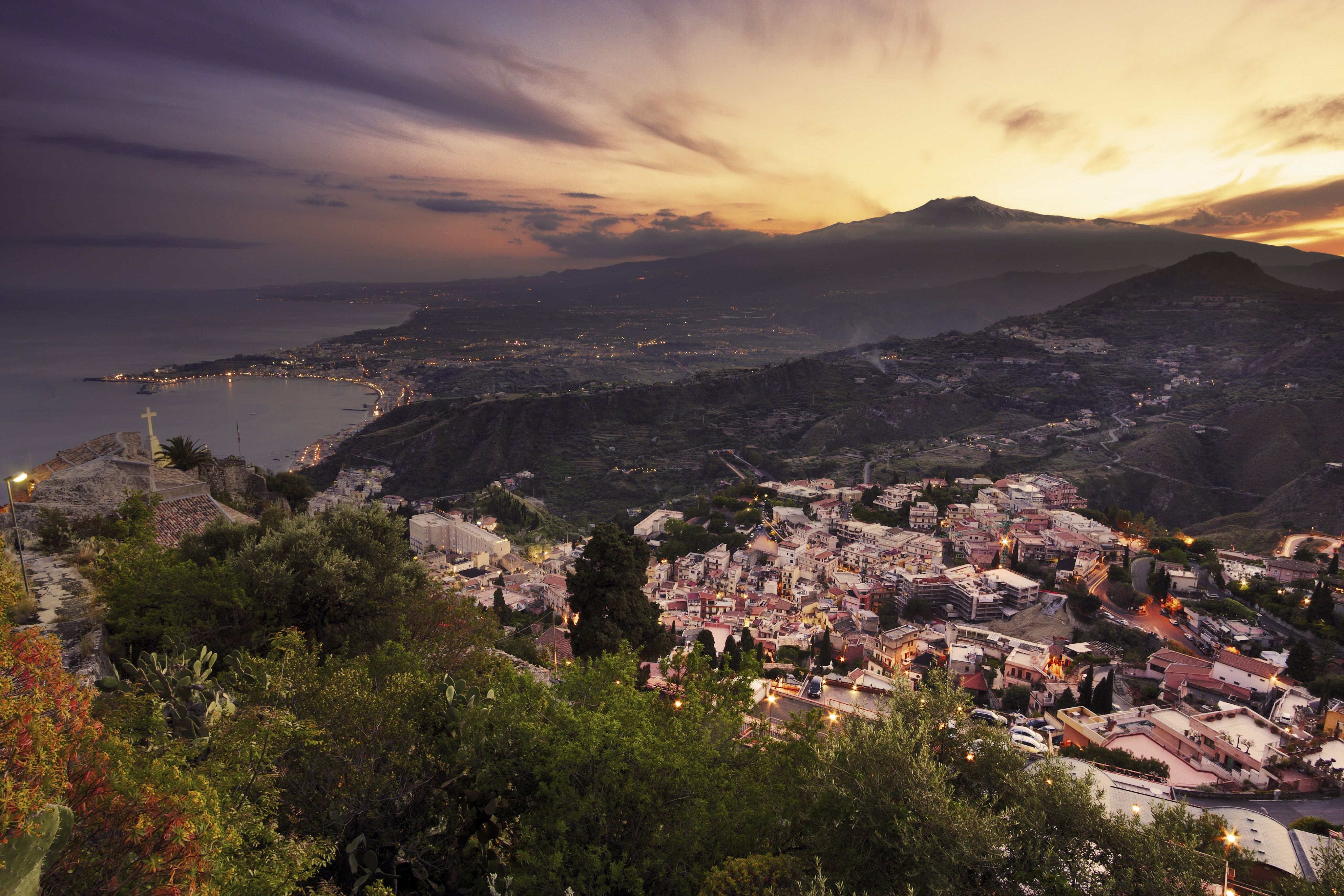 An aerial view of Mount Etna at sunset from Taormina in Sicily, Italy. Photo: Shutterstock