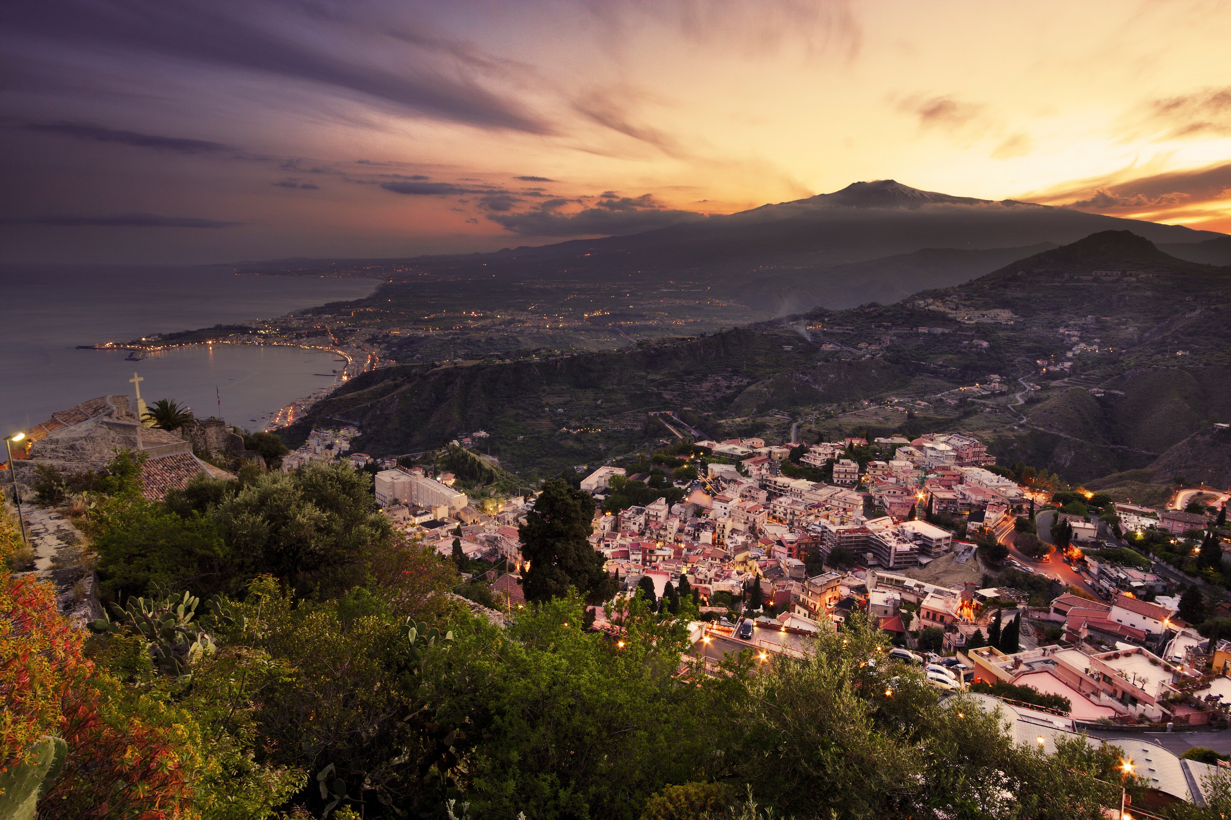 An aerial view of Mount Etna at sunset from Taormina in Sicily, Italy. Photo: Shutterstock