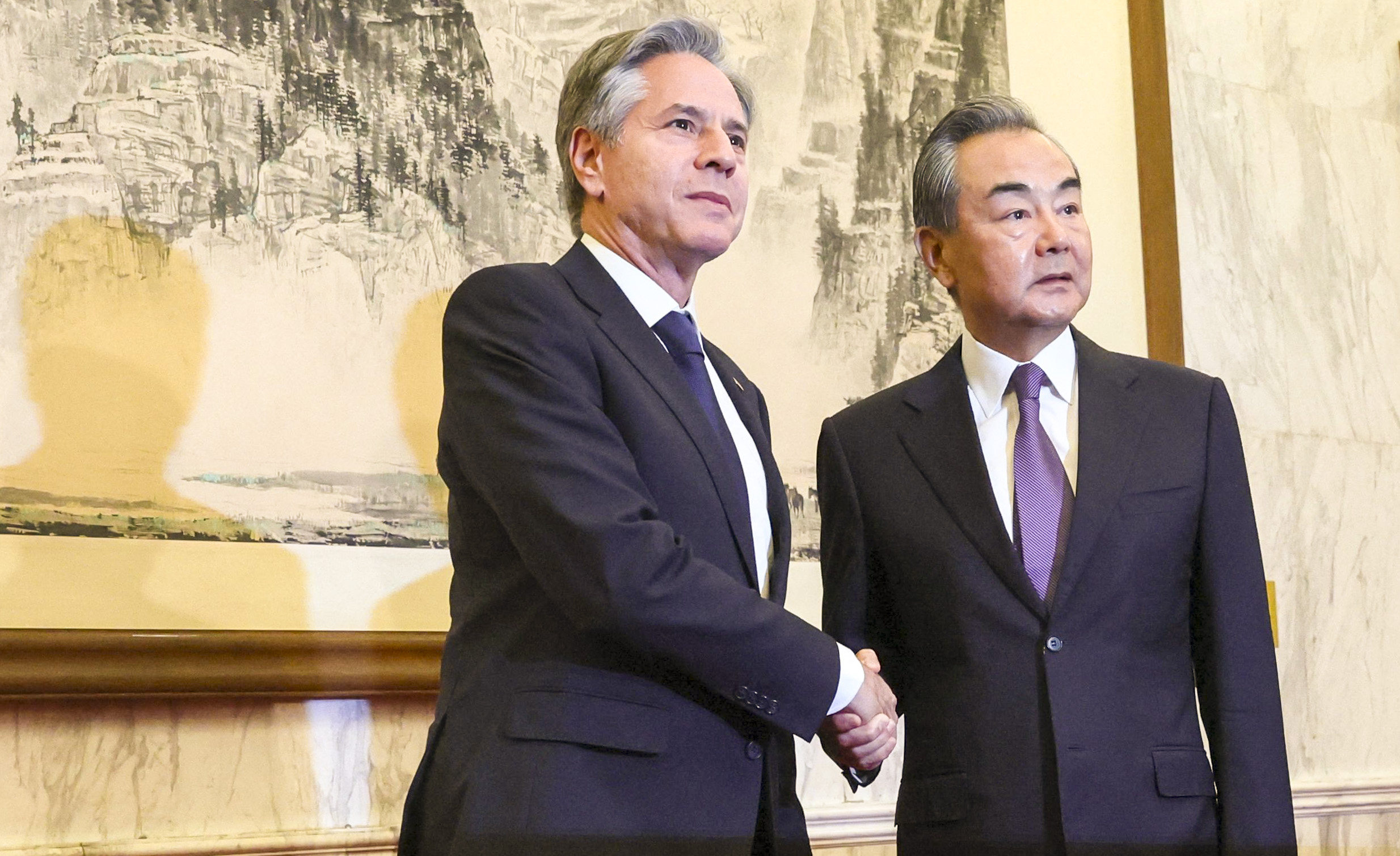 US Secretary of State Antony Blinken (L) shakes hands with China’s Director of the Office of the Central Foreign Affairs Commission Wang Yi in Beijing on June 19, 2023. Photo: AFP