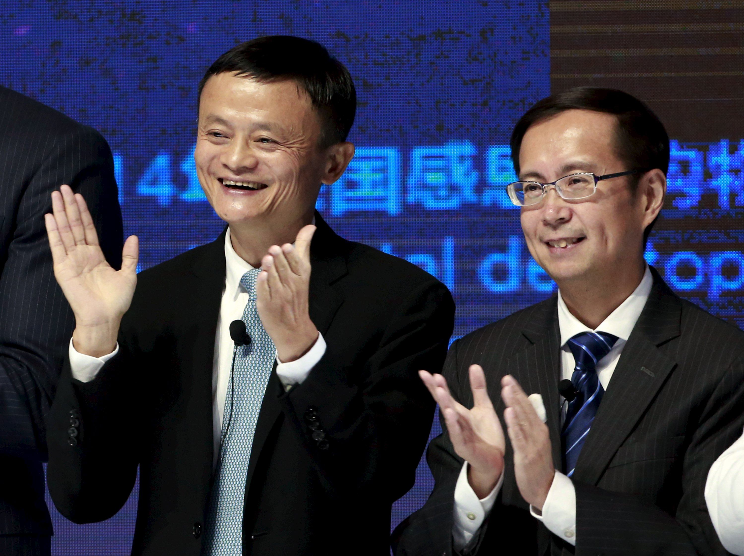 Alibaba founder and chairman Jack Ma (left) and CEO Daniel Zhang clap at the New York Stock Exchange Bell Ringing ceremony during Alibaba Group’s 11.11 Global Shopping Festival in Beijing on November 11, 2015. Photo: Reuters