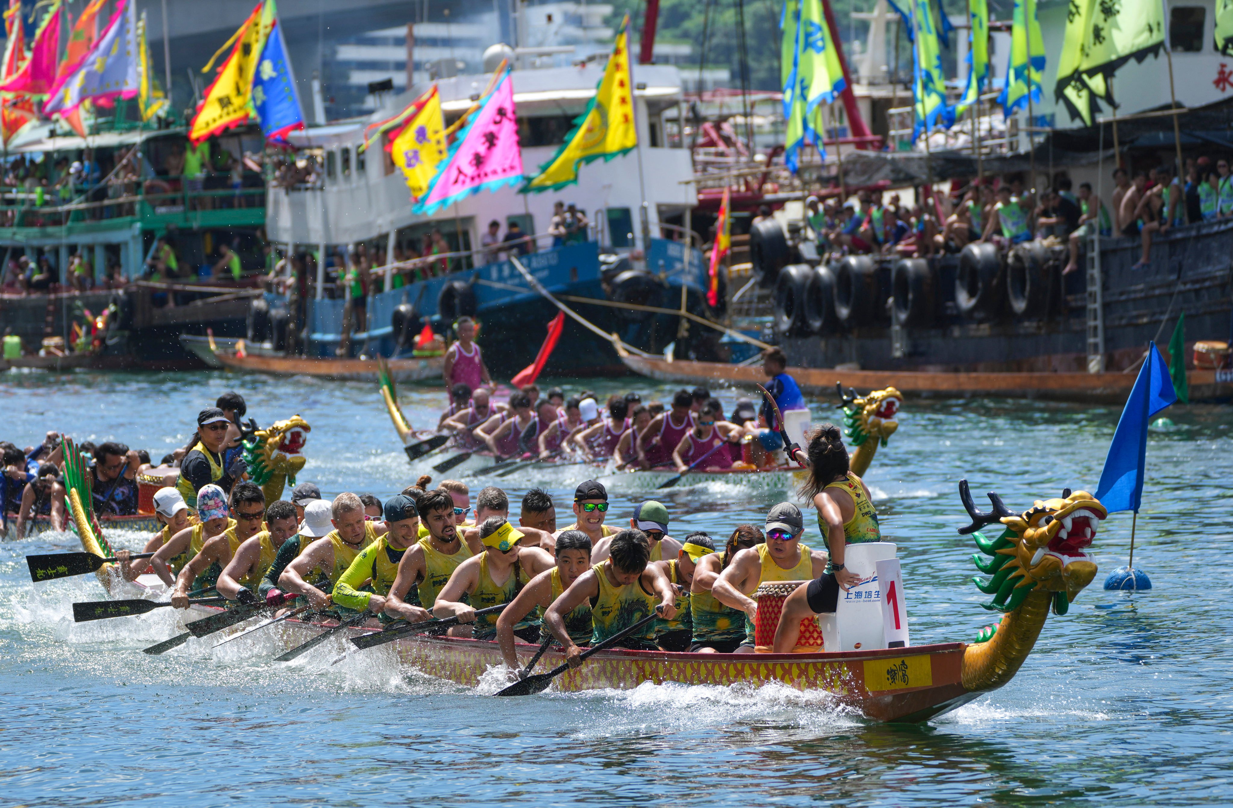 Rowers brave the heat to pit their skills against rivals in waters off Aberdeen. Photo: Sam Tsang
