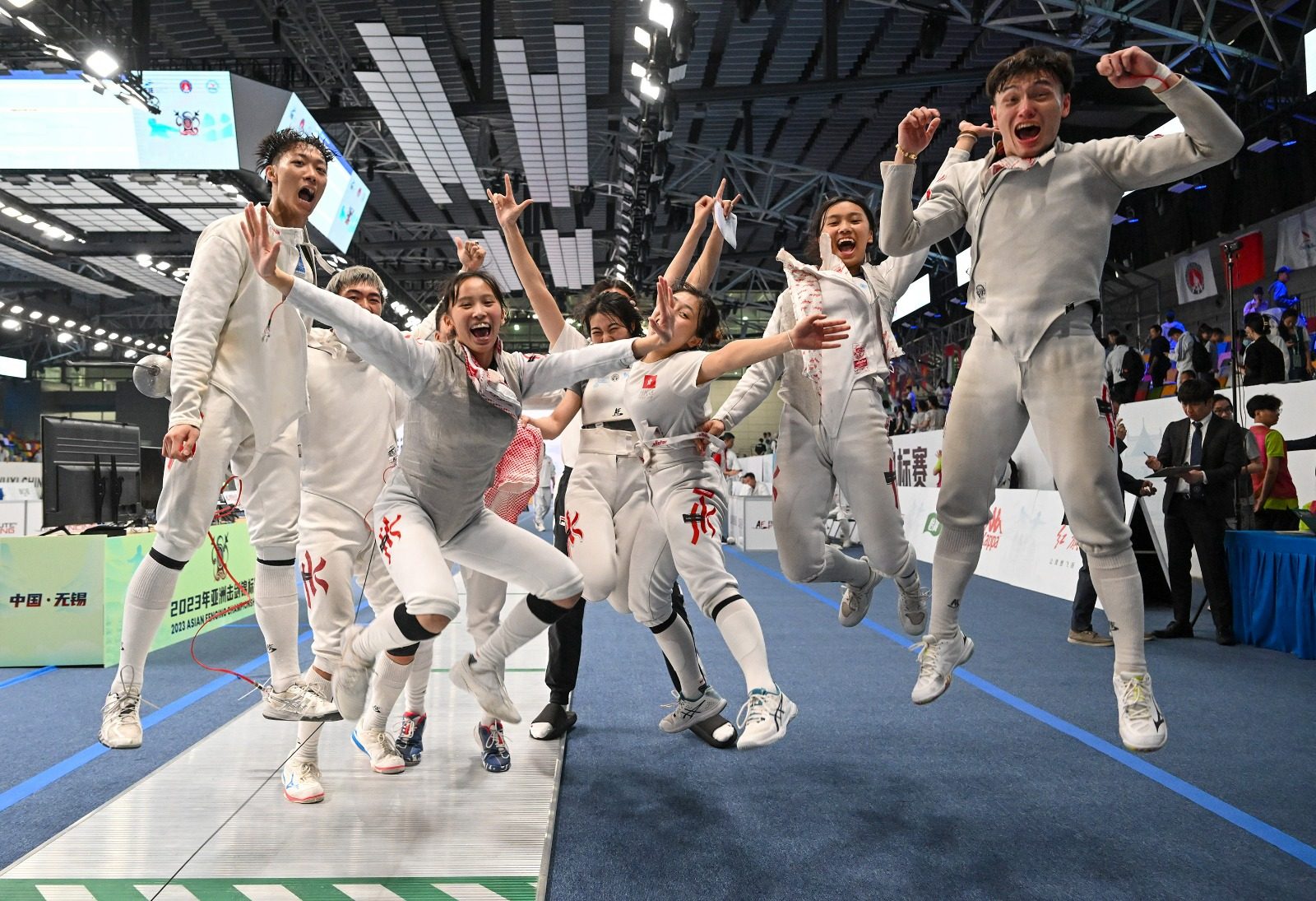 Hong Kong’s men’s epee and women’s foil teams celebrate after capturing bronze medals at the Asian Championships in Wuxi, China. Photo: Hong Kong Fencing Association