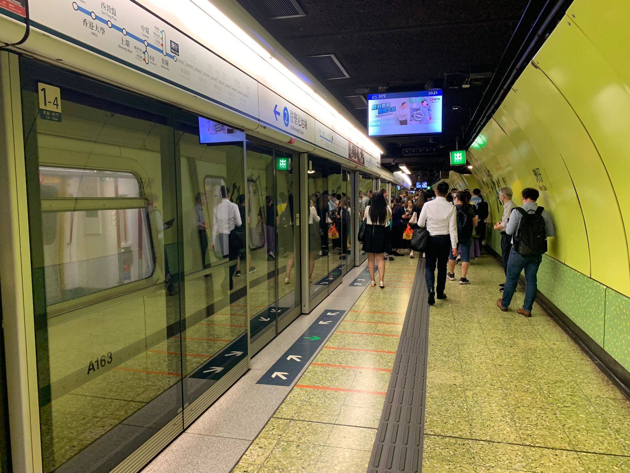 An investigation is focusing on MTR passengers’ use of an emergency exit to leave a carriage and walk on the tracks after train doors failed to open at Wan Chai station. Photo: Anna Verghese