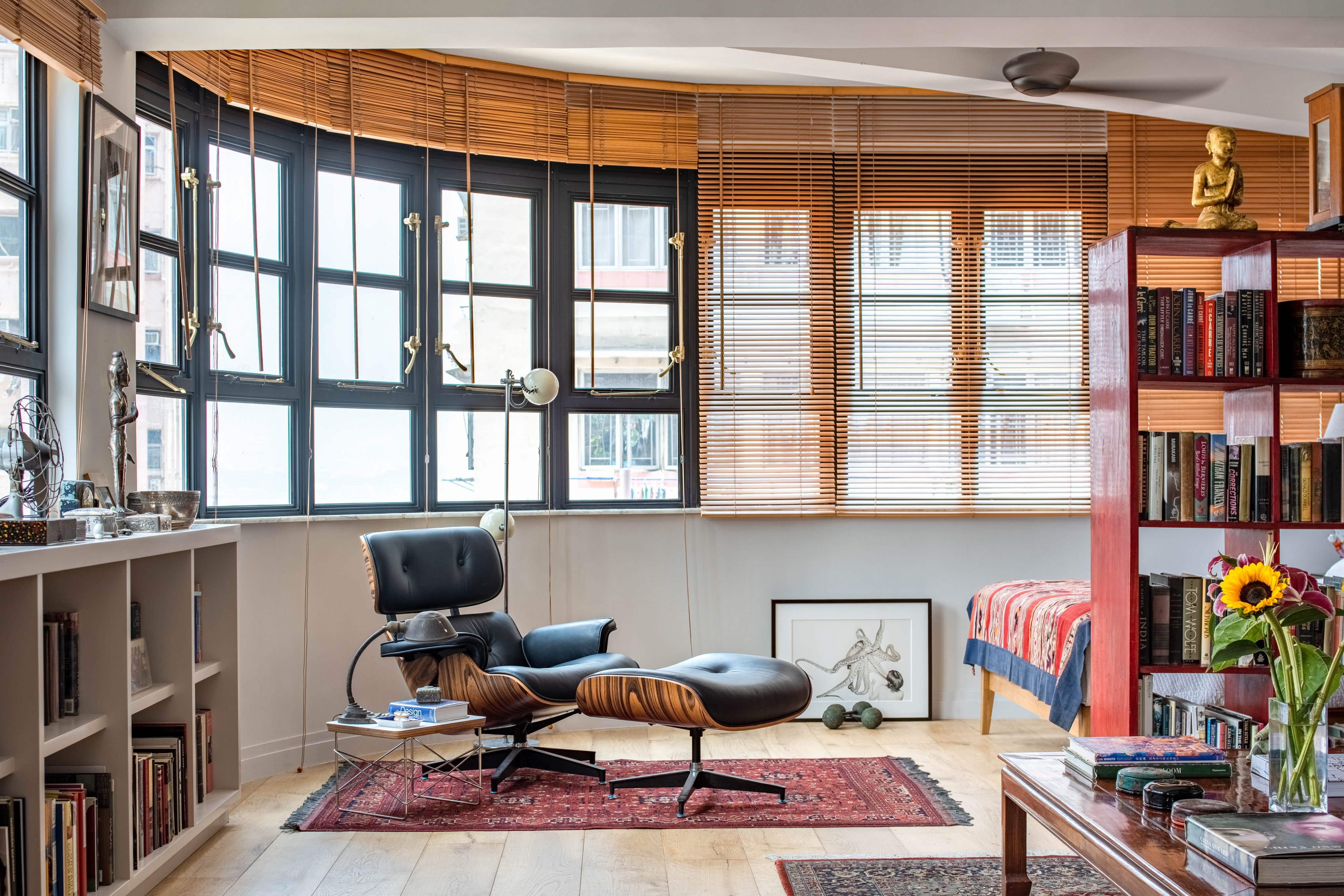 The windows in this refurbished flat in a 1960s corner building in Sai Ying Pun, Hong Kong, offer sweeping views of the neighbourhood and of Victoria Harbour, their steel frames and brass handles a mix of mid-century modern and colonial styles. Photo: Eugene Chan