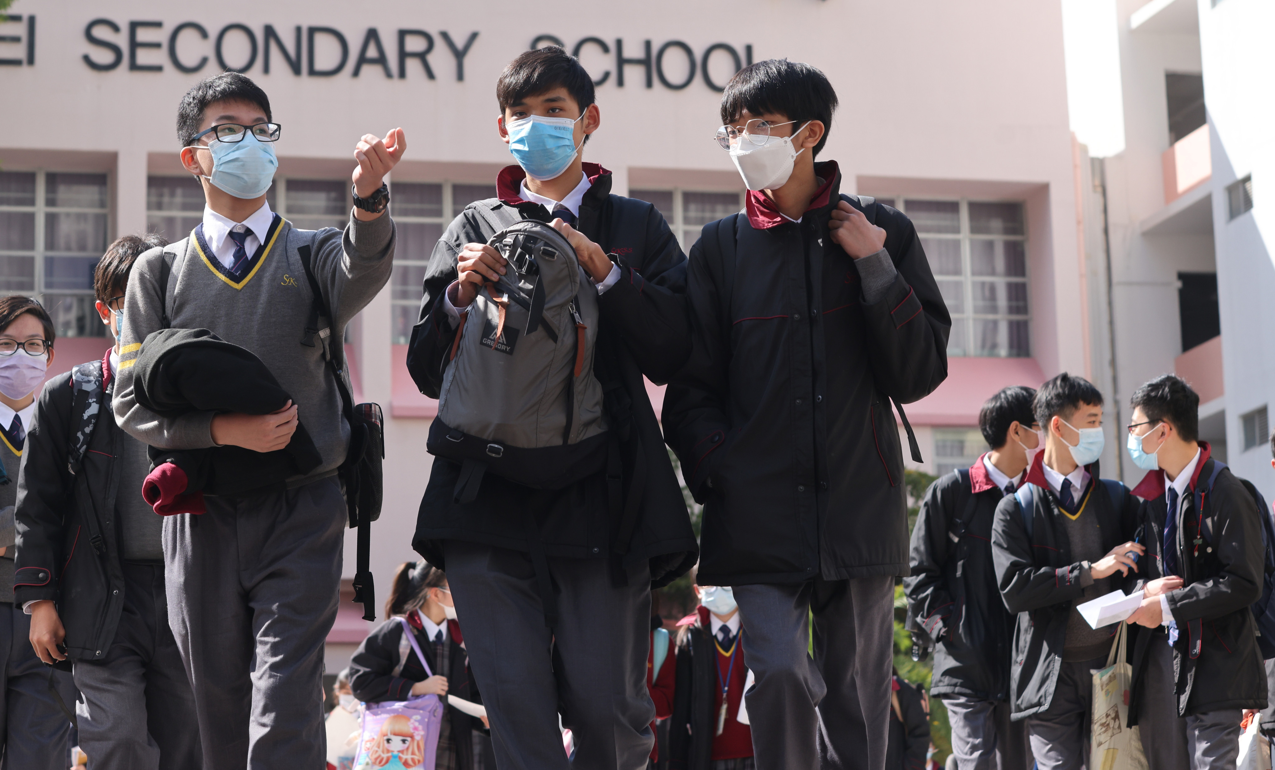 Students walk out of a school in Hong Kong’s Tseung Kwan O district in January last year. To boost students’ proficiency in English, schools should organise activities that provide more opportunities for students to use the language in real-life situations. Photo: May Tse