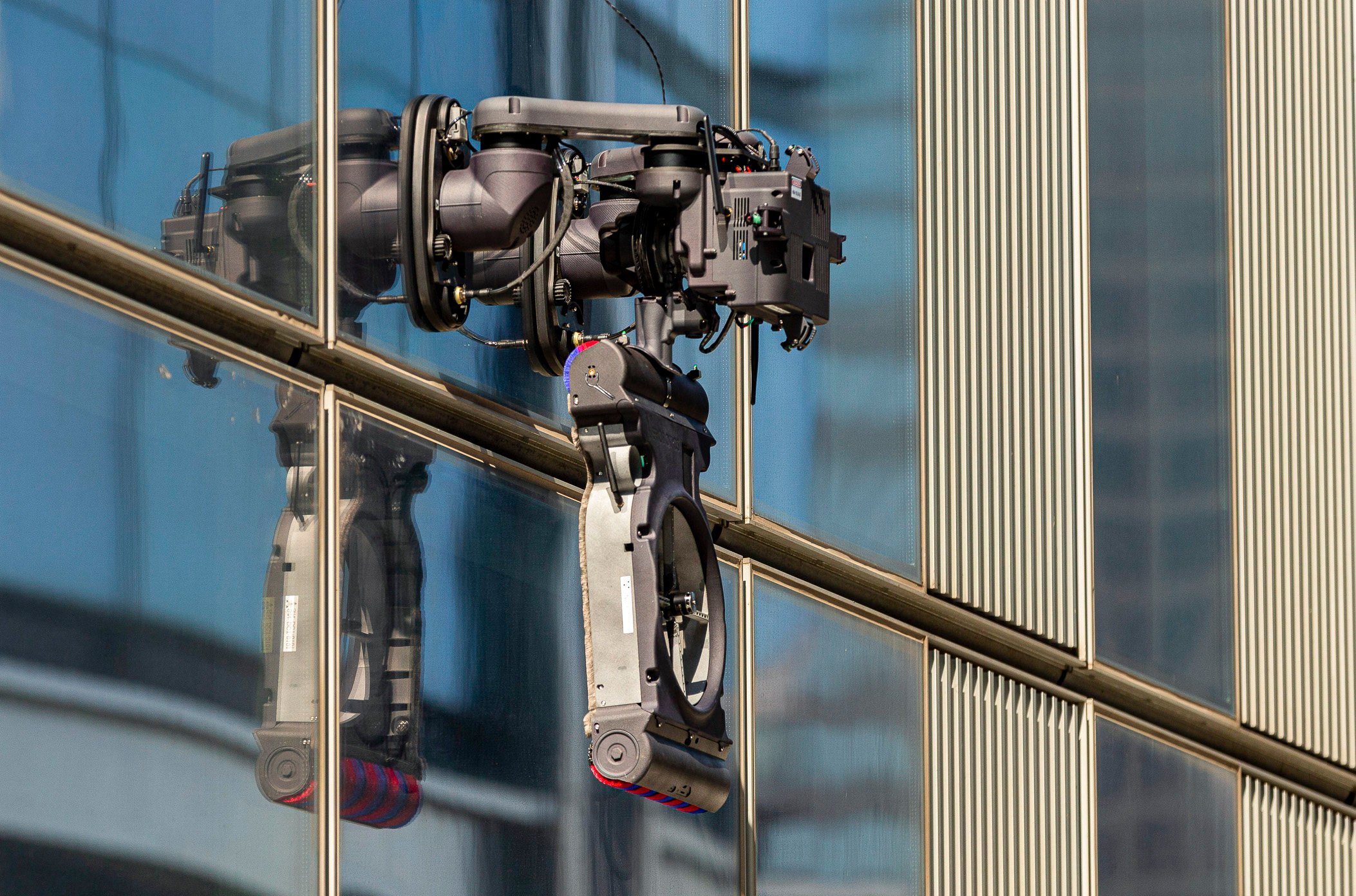 A close-up shot of the nine-kilogram, artificial intelligence-powered cleaning robot from Verobotics during a test on the facade of a high-rise building. Photo: Handout