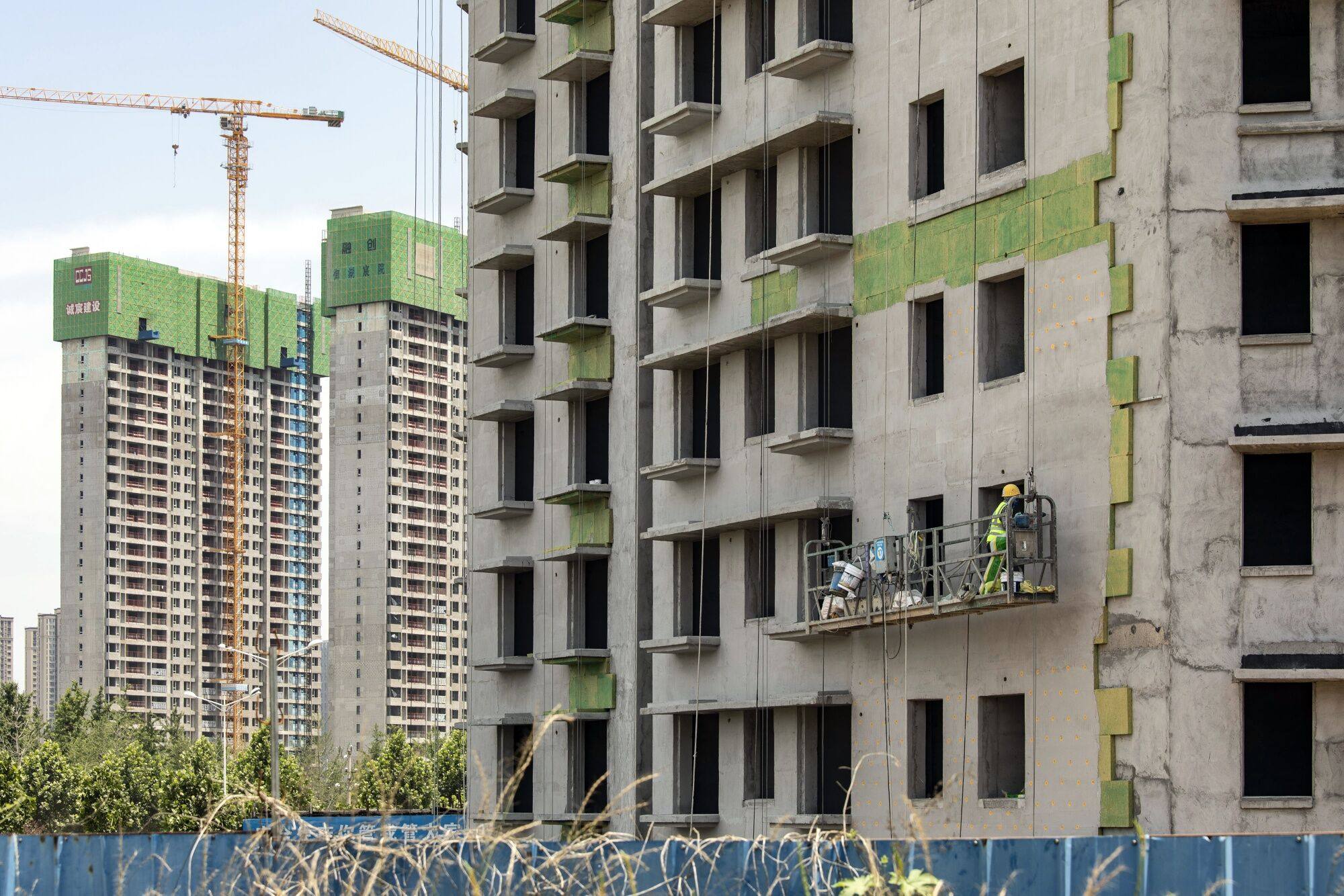 Residential buildings under construction in Zhengzhou, Henan province, China. China is working on a new basket of measures to support the property market. Photo: Bloomberg