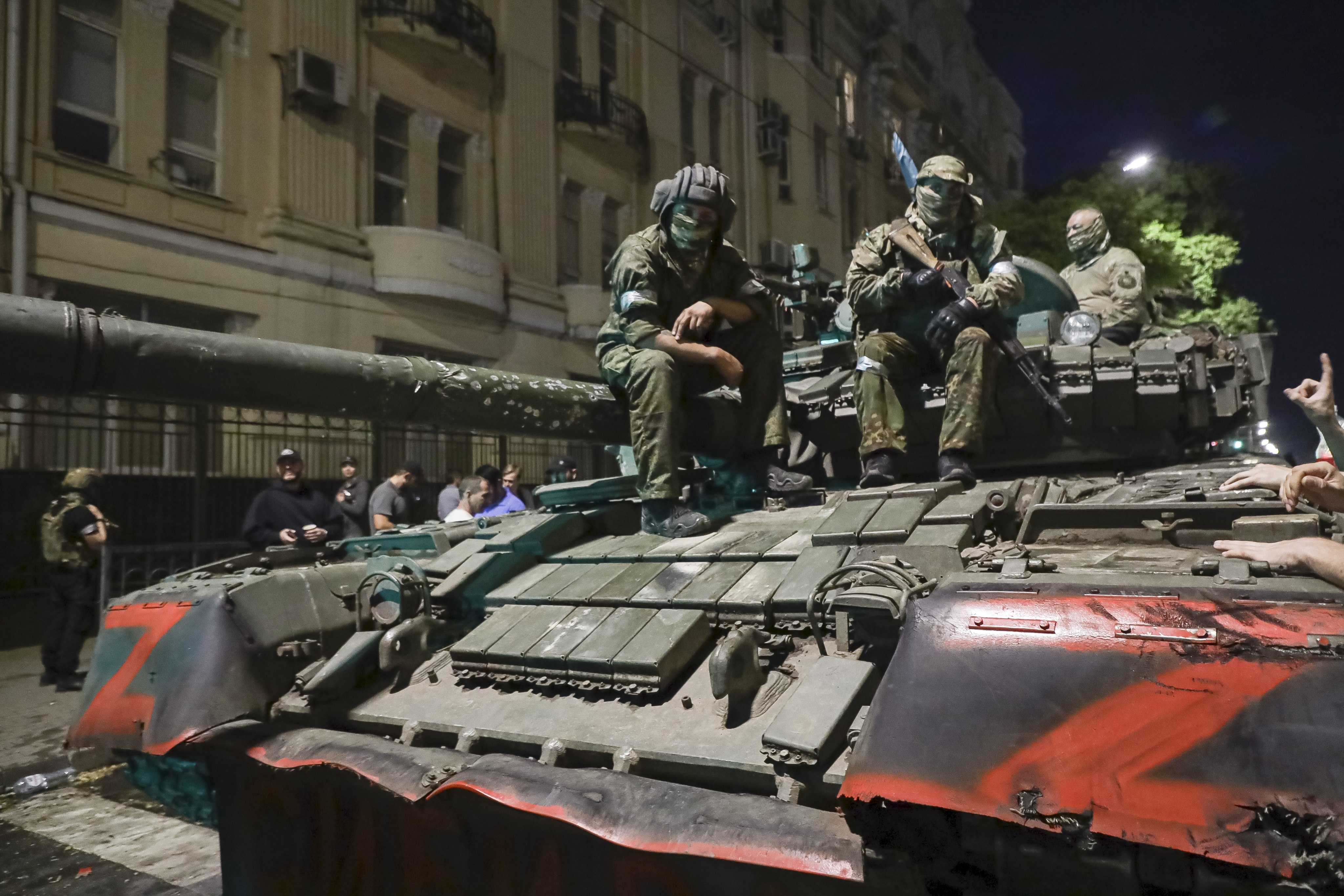 Members of the Wagner Group military company sit atop a tank on a street in Rostov-on-Don, Russia, on Saturday. Photo: AP