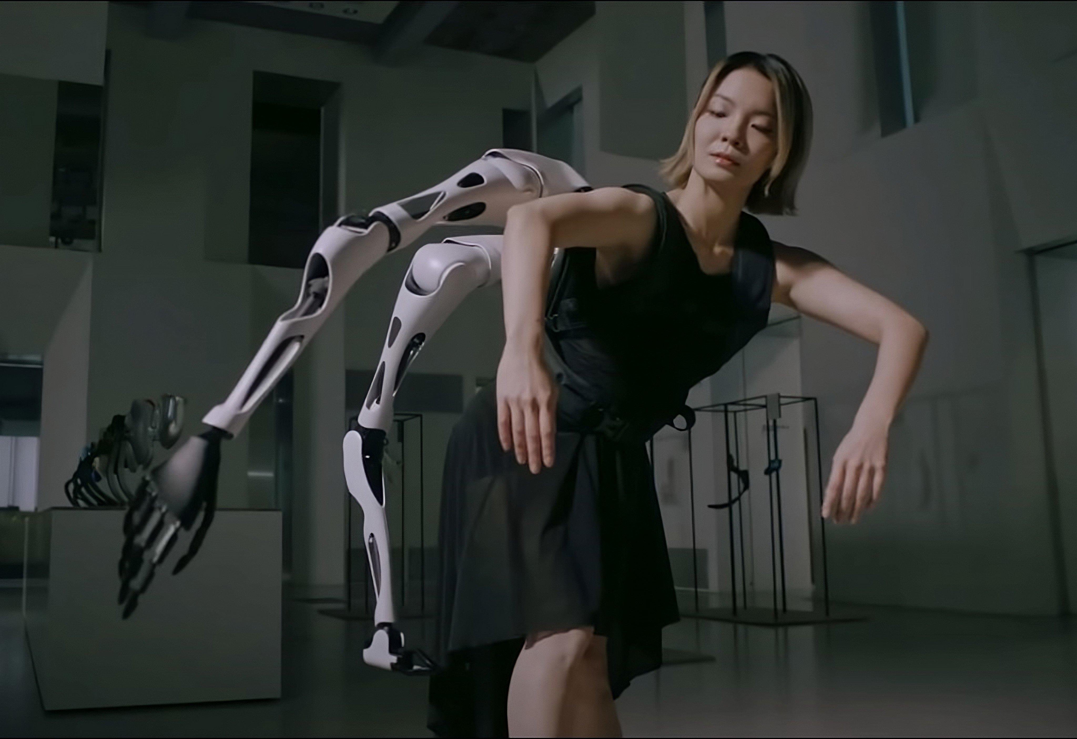 A ballet dancer wears the “Jizai Arms” in this still from a promotional video of a performance showing the robotic arms protruding from the dancers’ backs and torsos. Photo: YouTube/@inamijizaibodyproject585