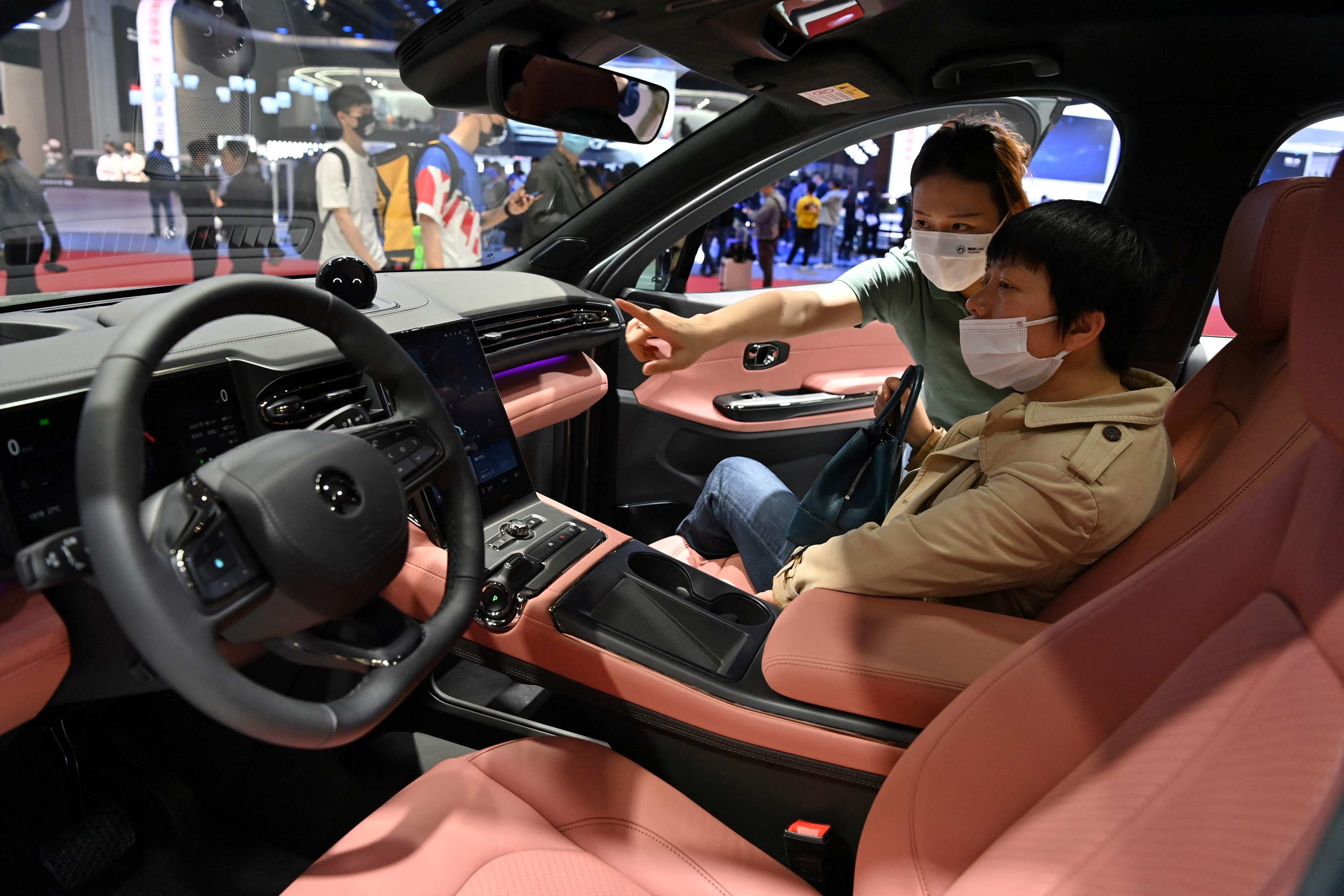 China’s young motorists are increasingly keen on EVs with intelligent features such as autonomous driving systems and AR. Photo: AFP