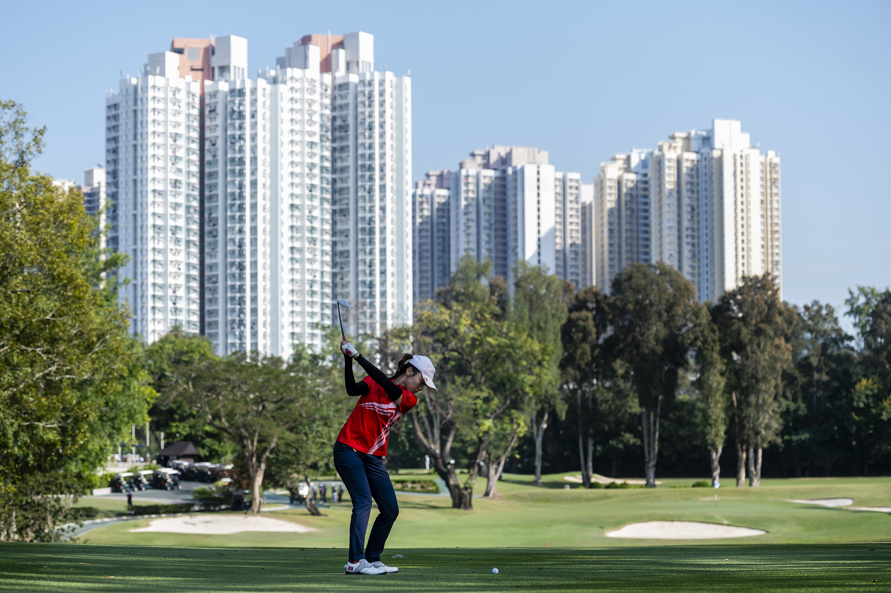 A golfer plays during a competition at the Hong Kong Golf Club on November 25, 2021. The government wants to take back 32 hectares of land, 9.5 hectares of which will be used to build 12,000 public housing flats. Photo: Getty Images