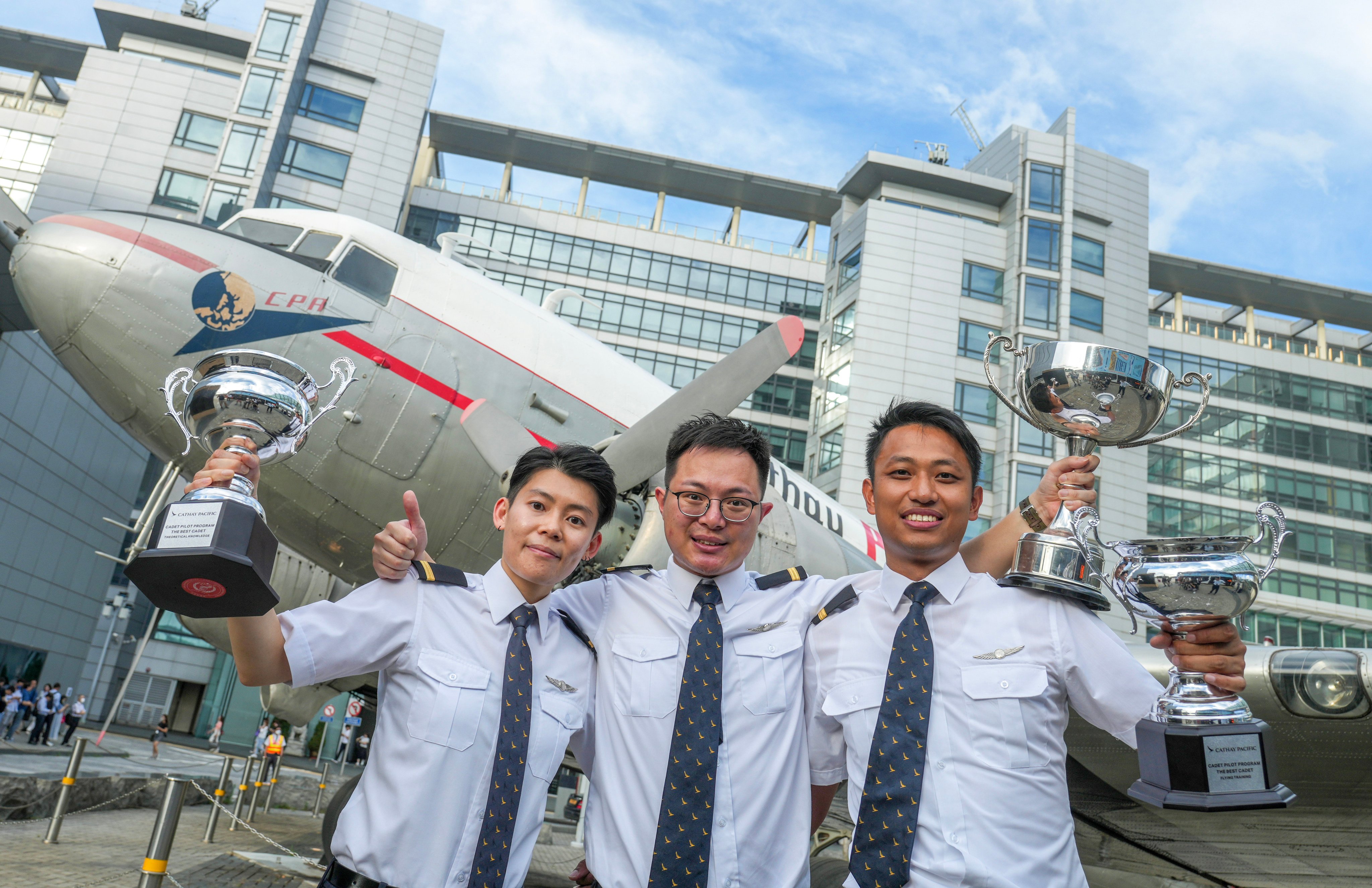 (From left) Trainee Cathay pilots Annie Chan, best theoretical knowledge trophy winner; Tom Kwan, the best all-round cadet and Desmond Tsui, the top in flying training, after their graduation ceremony. Photo: Sam Tsang