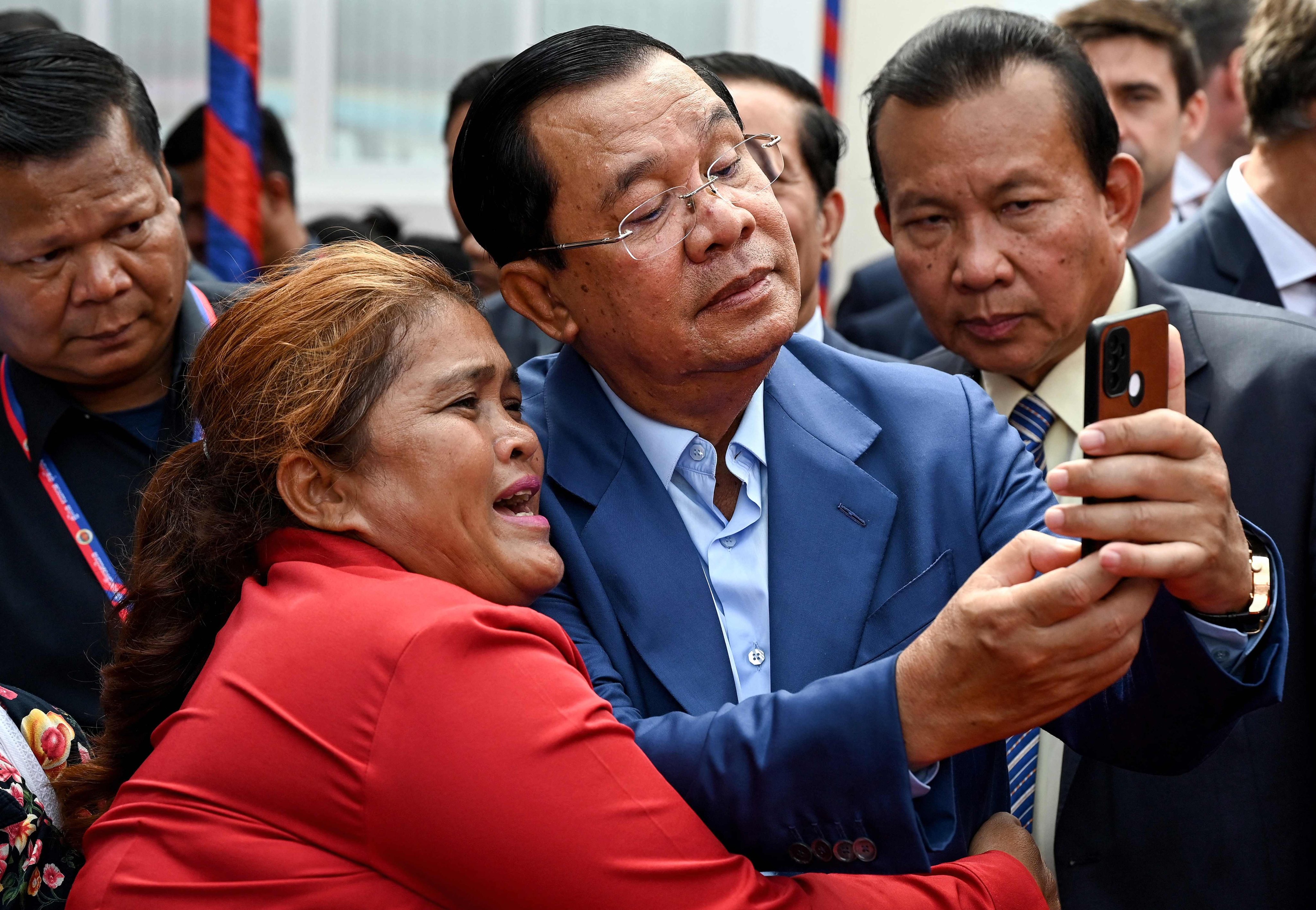 Cambodia’s Prime Minister Hun Sen takes a selfie with a supporter in Phnom Penh on June 19. Photo: AFP