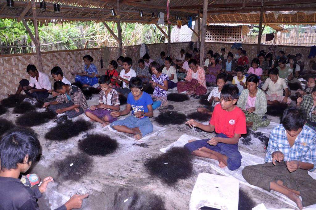 Children in Myanmar sort human hair in 2017. Human hair was being smuggled from India into Myanmar as early as 2012, industry-insiders say. Photo: Sunil Eamani