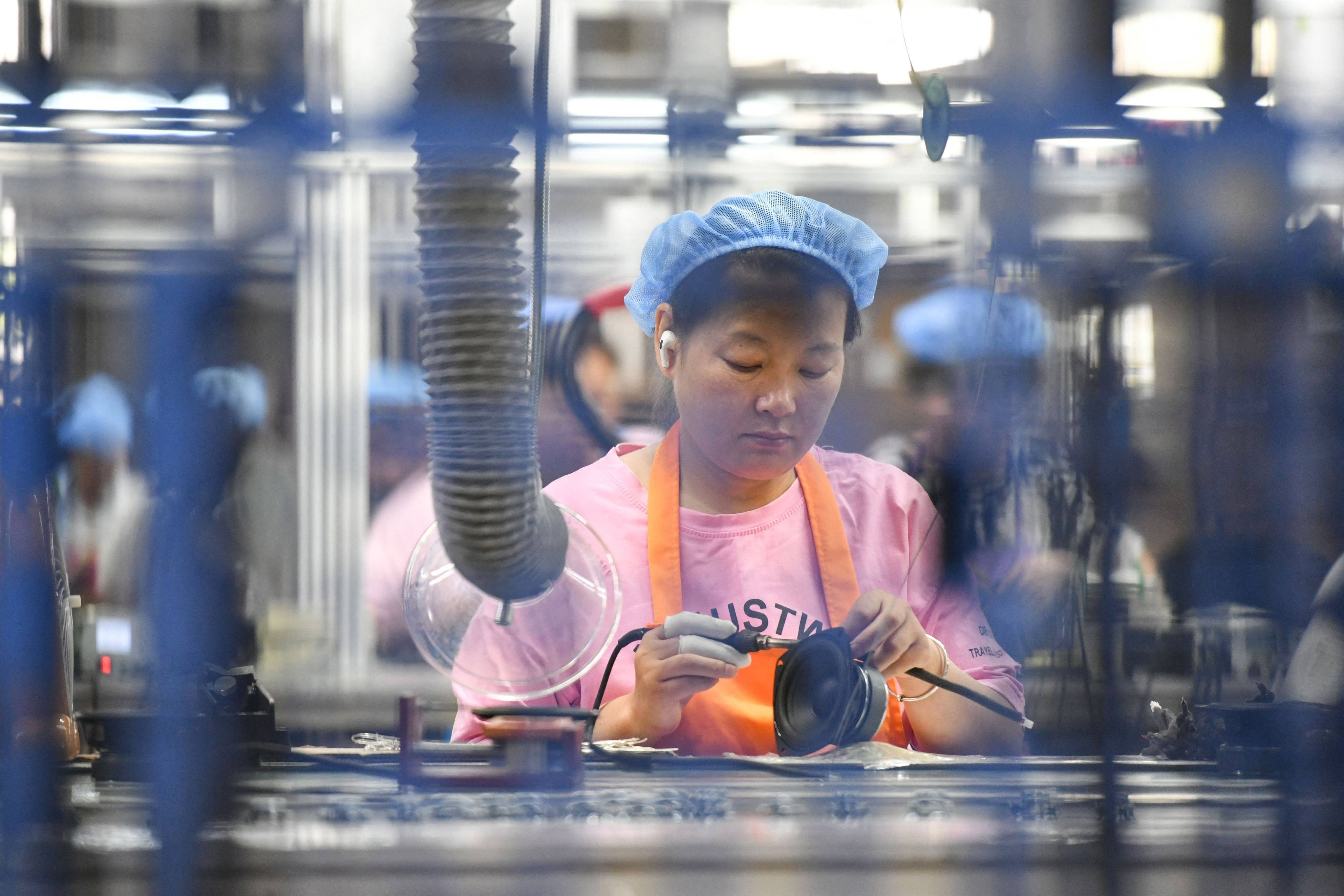 China’s official manufacturing purchasing managers’ index (PMI) rose to 49 in June from 48.8 in May. Photo: AFP