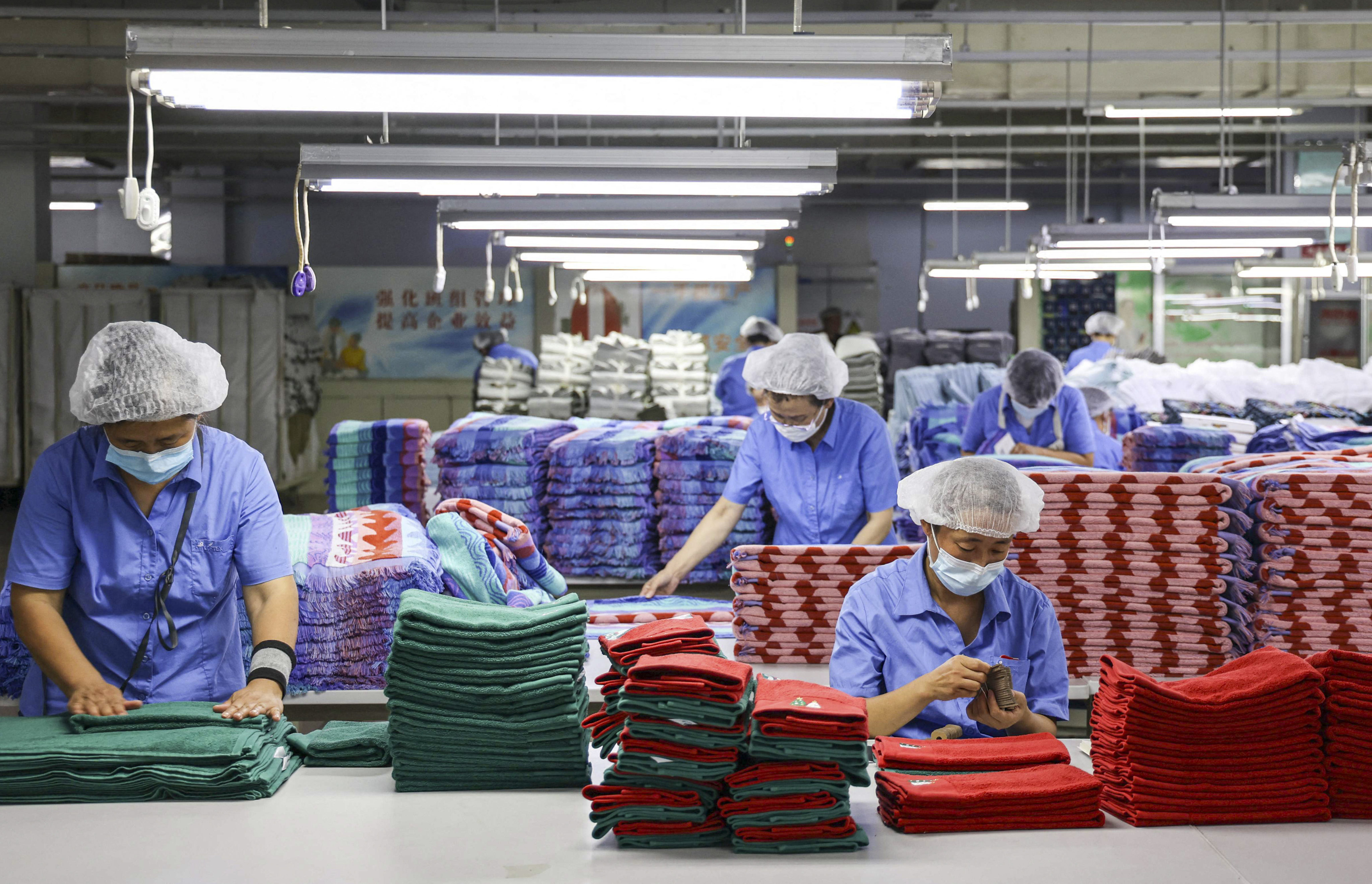 Demographers say that long-held manufacturing advantages still give China an edge over India. Photo: AFP