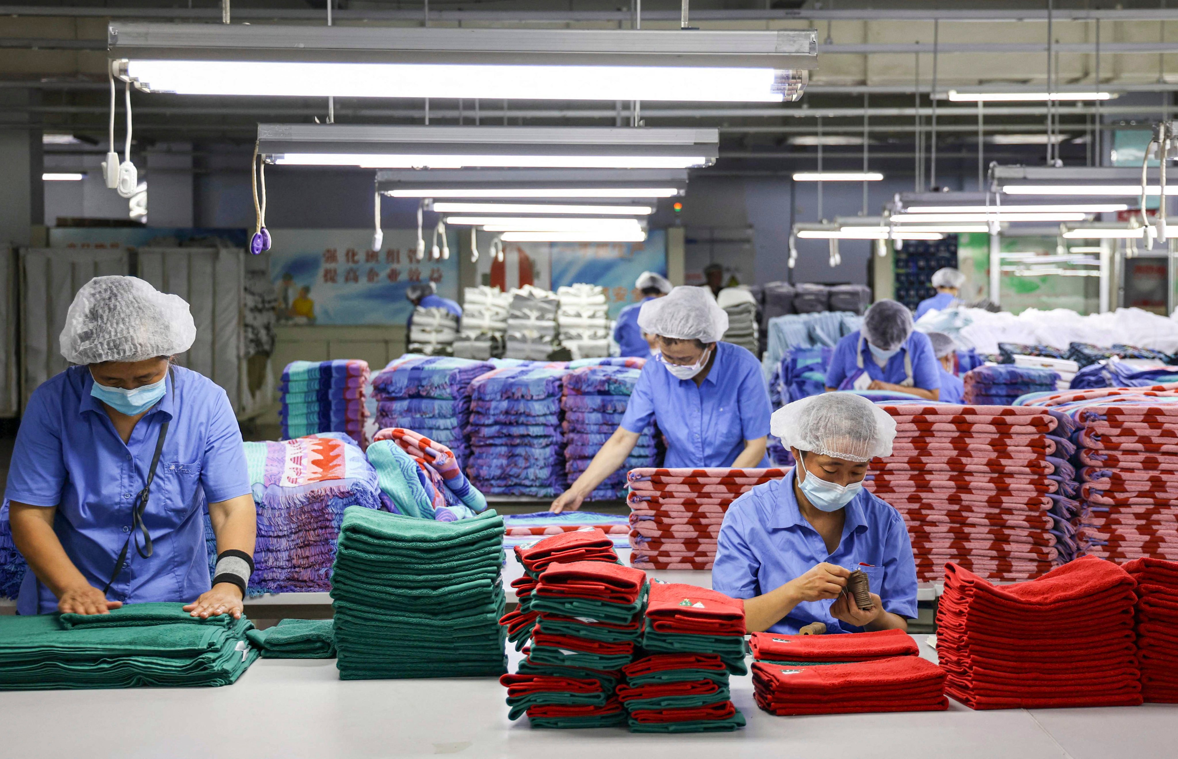 Demographers say that long-held manufacturing advantages still give China an edge over India. Photo: AFP