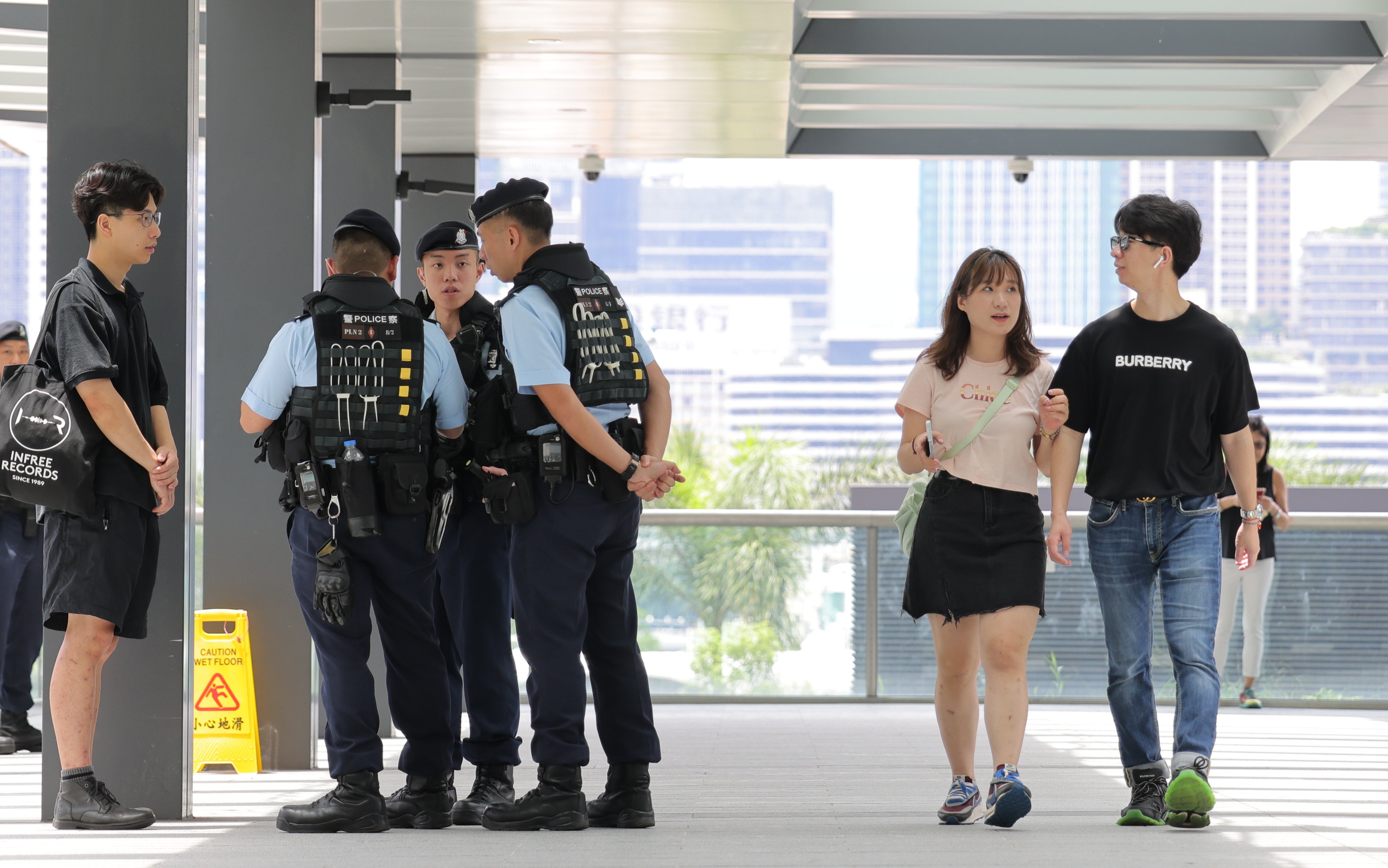 Police officers outside the Hong Kong Convention and Exhibition Centre on Friday, where a flag raising ceremony and cocktail reception will be held as part of the commemoration. Photo: Jelly Tse