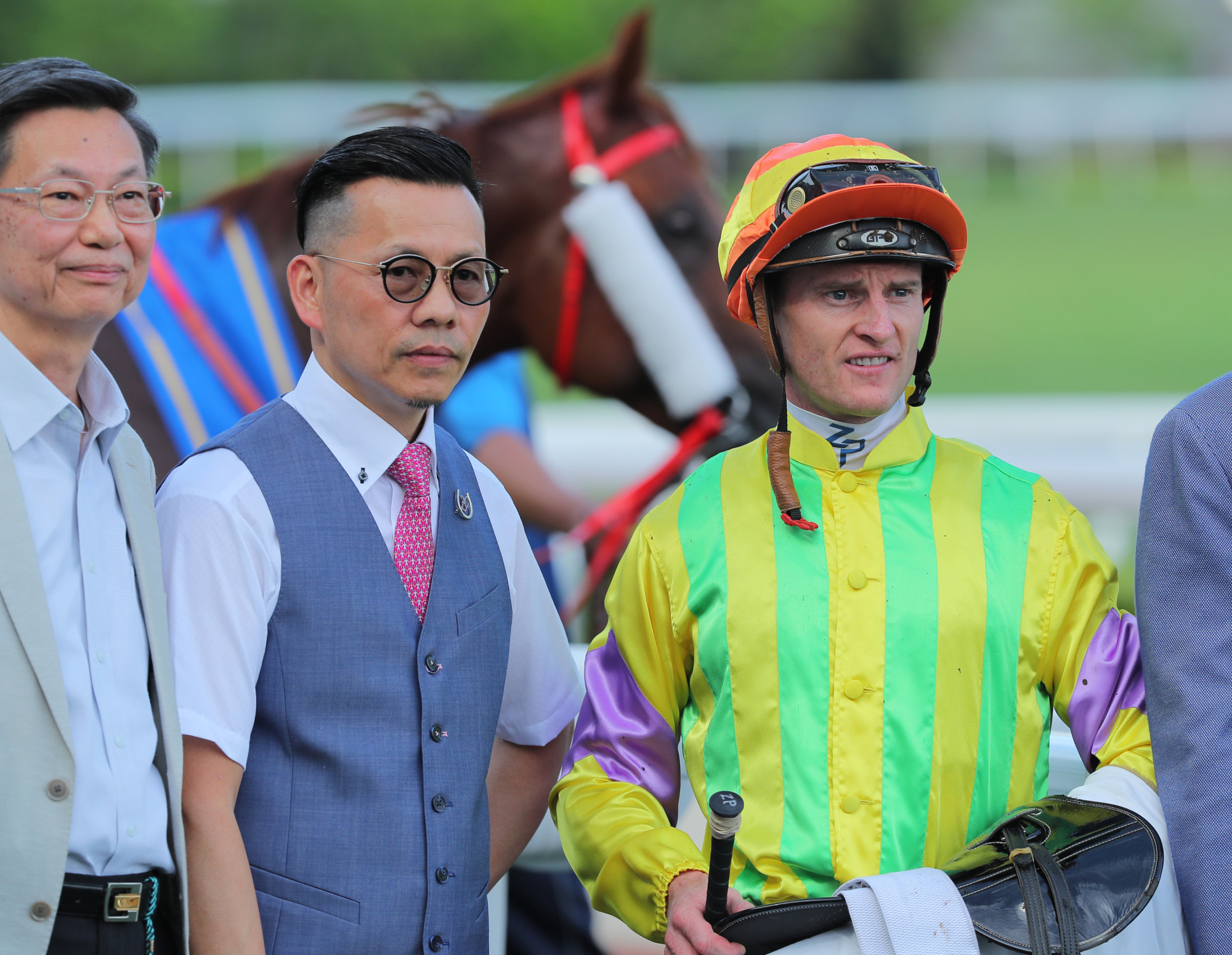 Trainer Frankie Lor and jockey Zac Purton celebrate Sword Point’s Hong Kong Reunification Cup win with connections.