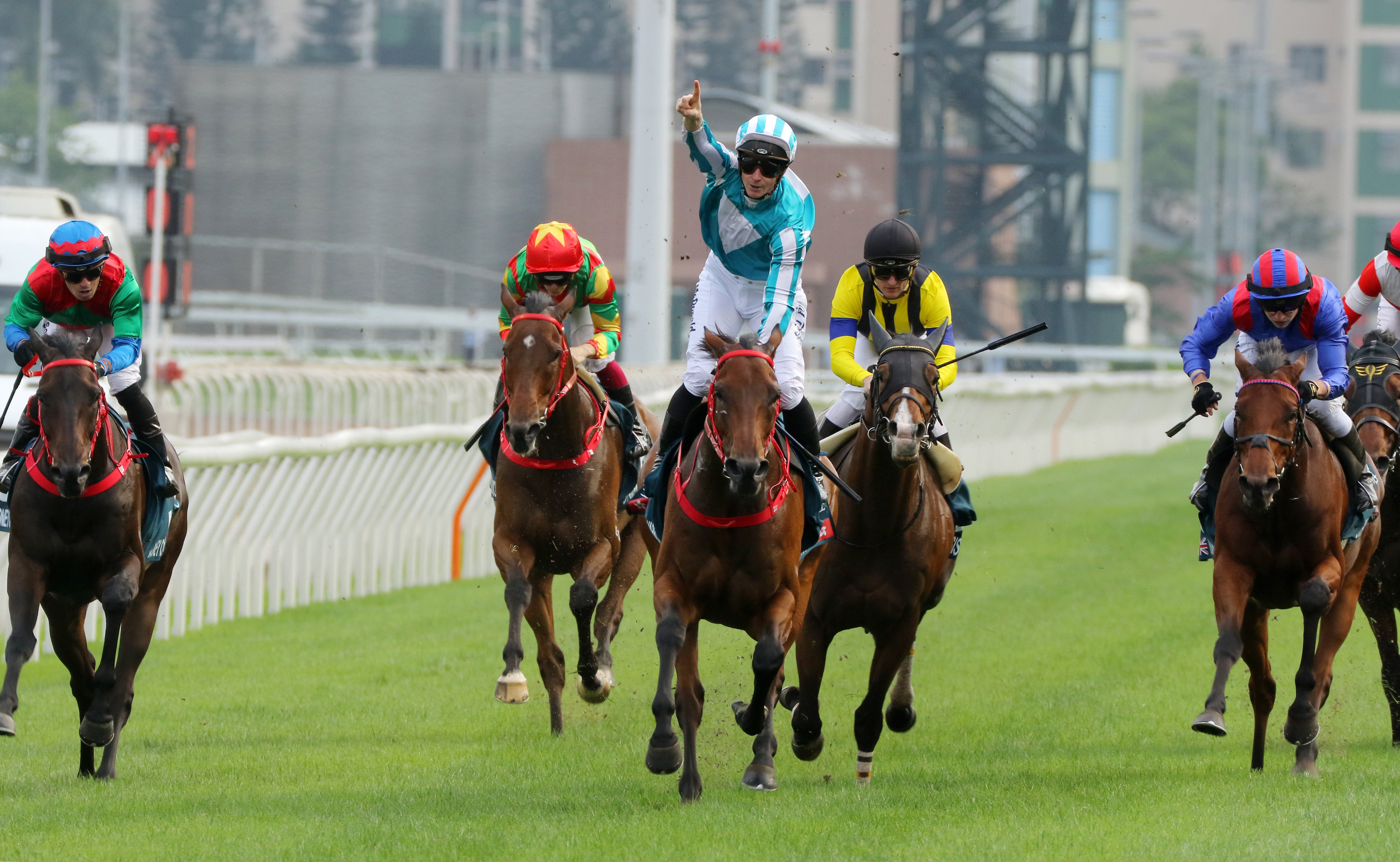 Romantic Warrior (middle) wins the Group One QE II Cup under James McDonald in April. Photo: Kenneth Chan