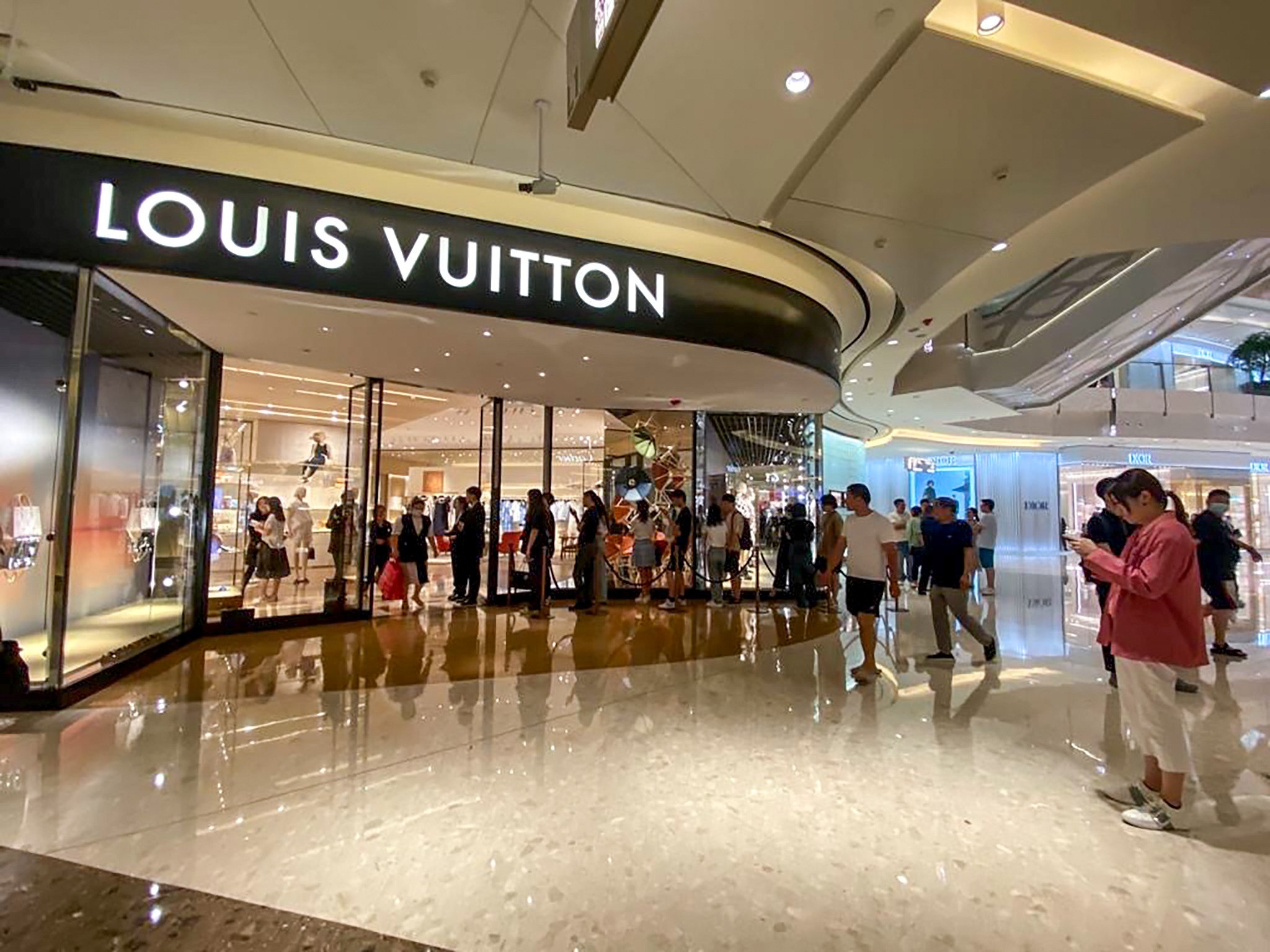 Shoppers line up outside the Louis Vuitton shop in a Shanghai mall on the day LVMH chairman Bernard Arnault visited.  Photo: Handout